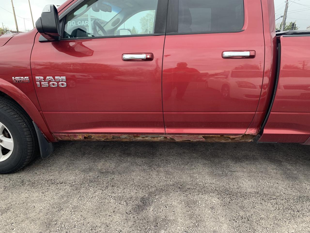 2014 RAM 1500 4WD Quad Cab 140.5  Outdoorsman Photo