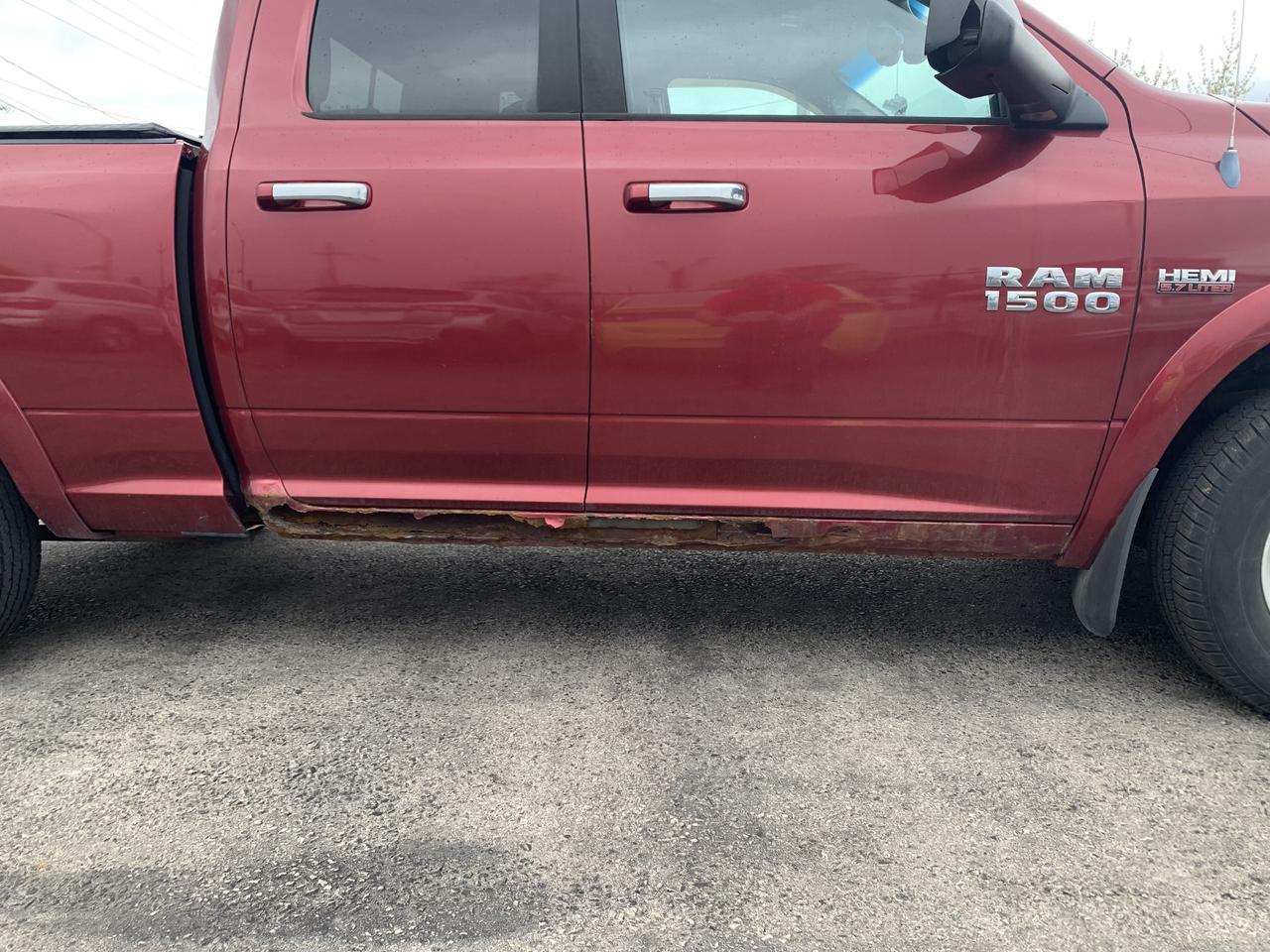 2014 RAM 1500 4WD Quad Cab 140.5  Outdoorsman Photo2
