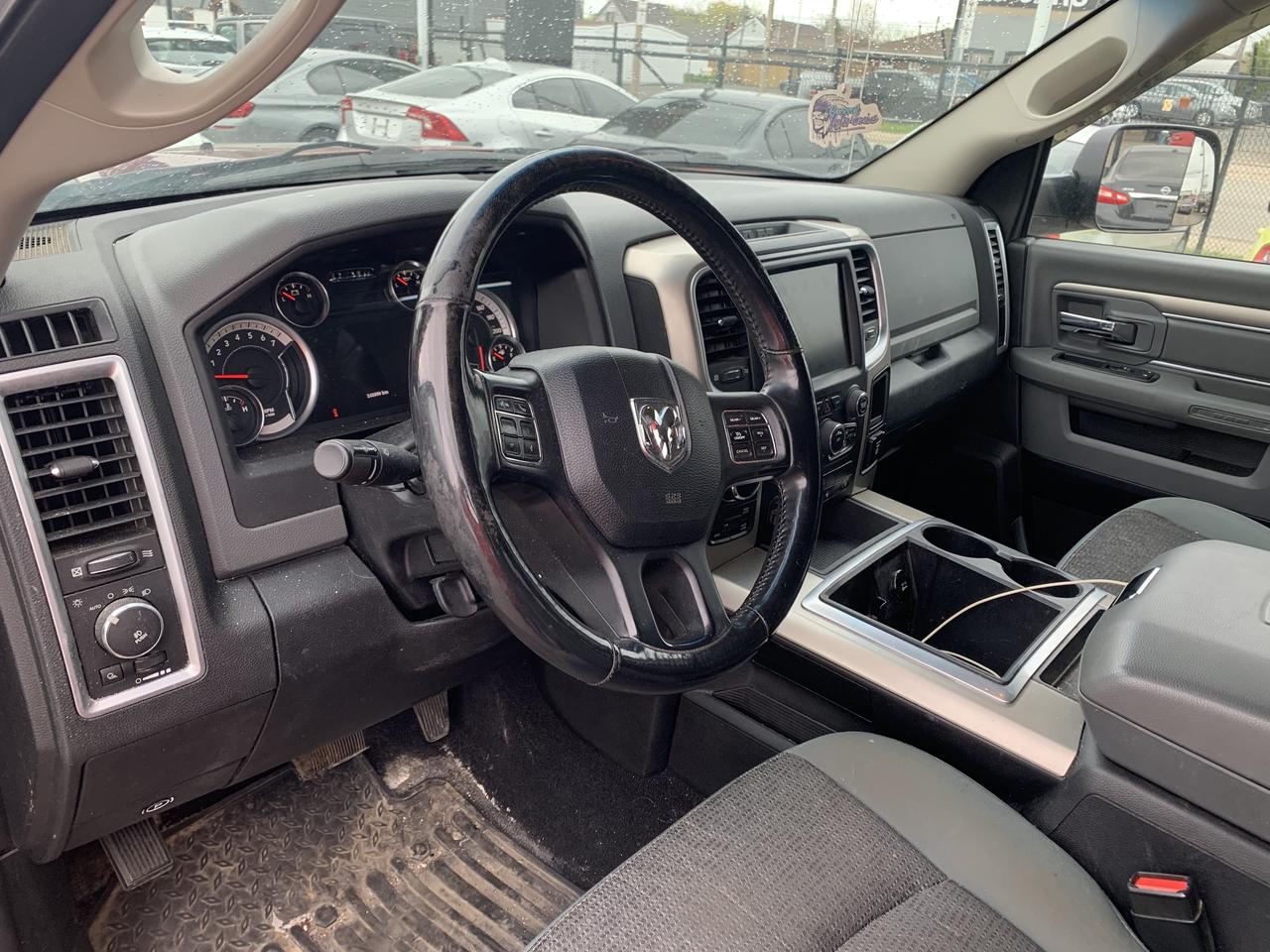 2014 RAM 1500 4WD Quad Cab 140.5  Outdoorsman Photo