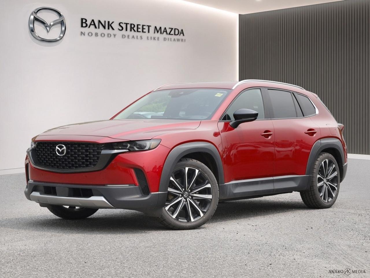 The 2023 Mazda CX-50 GT w/Turbo AWD, dressed in a refined palette and equipped with an All-Wheel Drive system, offers remarkable handling and control regardless of the driving conditions. This SUV proudly carries the sleek and bold styling that Mazda is known for, wrapped in aerodynamic lines and sitting on striking alloy wheels. The interior of the Mazda CX-50 is crafted for sophistication and comfort. Inside, youll find premium features such as supple seating with heated and cooled options, providing optimum comfort for all your travels. The spacious cabin is complemented by a sunroof/moonroof, inviting the natural light in and elevating the driving experience. Technology takes the front seat with the Mazda CX-50s array of features. Navigate your journeys effortlessly with the integrated navigation system, and enjoy seamless connectivity with Bluetooth and smart device integration. The heads-up display keeps crucial information in your line of sight, and the backup camera and parking sensors assist in those tight spots. With safety features like lane assist and brake assist, your peace of mind is prioritized on every drive. This SUV is ideal for adventurous families and busy professionals who value performance and style in equal measure. Experience the 2023 Mazda CX-50 GT w/Turbo AWD for yourself; contact us today for more information and to schedule your test drive.