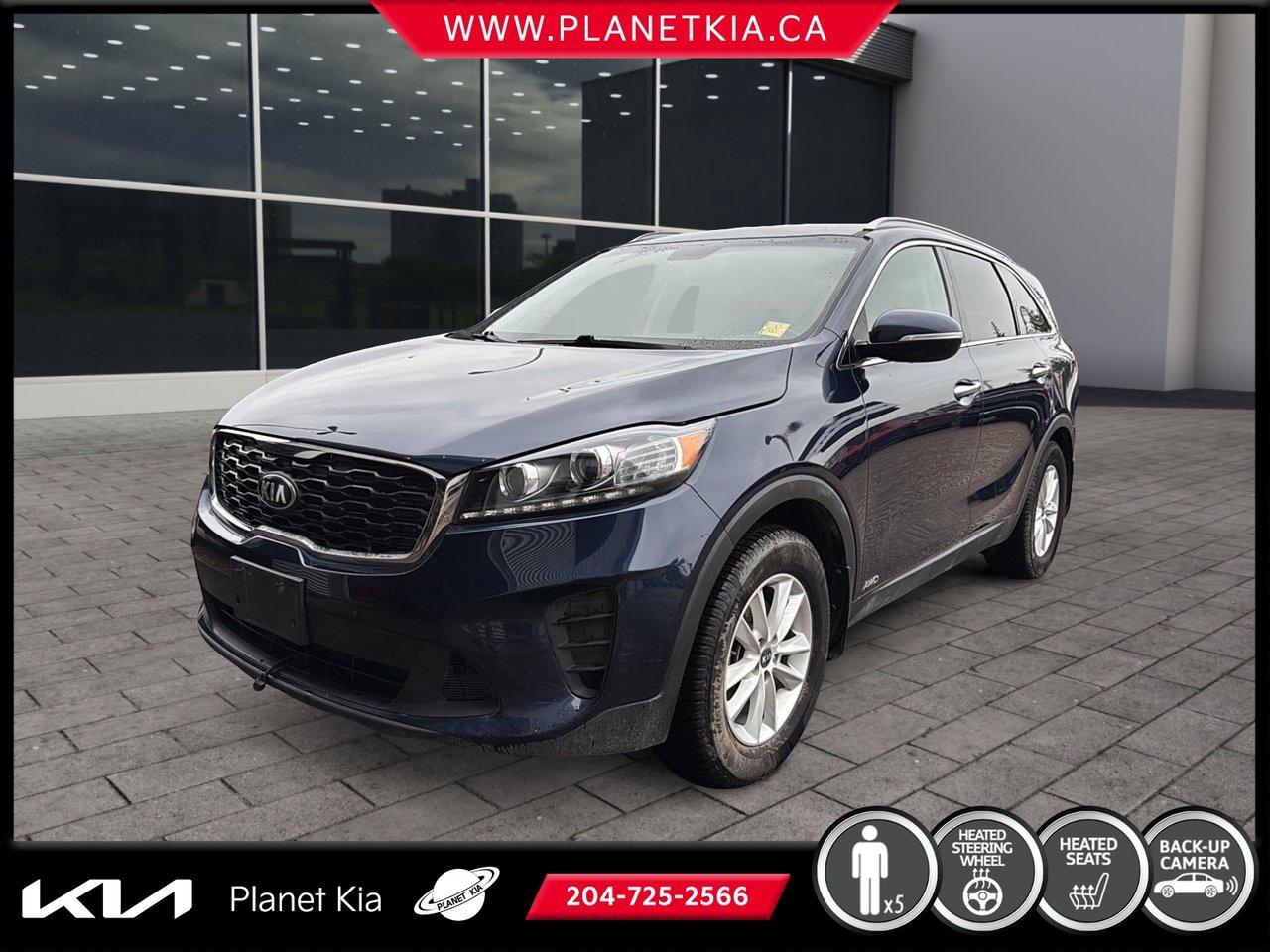 <h1 data-section-id=hmif5z data-start=0 data-end=51>2019 Kia Sorento LX for Sale in Brandon, Manitoba</h1>
<h2 data-section-id=1hedpmt data-start=53 data-end=109>Dependable, Spacious, and Built for Manitoba Families</h2>
<p data-start=111 data-end=446>The <strong data-start=115 data-end=138>2019 Kia Sorento LX</strong> is a versatile midsize SUV that delivers the perfect blend of comfort, capability, safety, and value. Designed to accommodate busy families and active lifestyles, the Sorento offers a spacious interior, confident performance, advanced technology, and the practicality you need for everyday life in Manitoba.

<p data-start=448 data-end=638>Available now at <strong data-start=465 data-end=500>Planet Kia in Brandon, Manitoba</strong>, this well-maintained SUV is ready to handle everything from daily commutes and school runs to weekend road trips and outdoor adventures.

<h2 data-section-id=rtjbw0 data-start=640 data-end=668>Key Features & Highlights</h2>
<h3 data-section-id=onlzhk data-start=670 data-end=699><span role=text><strong data-start=674 data-end=699>Confident Performance</strong></span></h3>
<p data-start=700 data-end=953>The 2019 Sorento LX delivers smooth power, responsive handling, and a comfortable ride that makes every journey enjoyable. Whether youre navigating city streets or travelling Manitoba highways, youll appreciate its balanced performance and refinement.

<h3 data-section-id=dbm8q4 data-start=955 data-end=988><span role=text><strong data-start=959 data-end=988>Available All-Wheel Drive</strong></span></h3>
<p data-start=989 data-end=1182>Be prepared for Manitobas changing weather conditions with available all-wheel drive, helping provide enhanced traction and confidence on snow-covered roads, gravel highways, and wet pavement.

<h3 data-section-id=1yng5uf data-start=1184 data-end=1209><span role=text><strong data-start=1188 data-end=1209>Spacious Interior</strong></span></h3>
<p data-start=1210 data-end=1393>The Sorento offers generous passenger room and comfortable seating, ensuring everyone can travel in comfort whether its a quick trip across Brandon or a long-distance family getaway.

<h3 data-section-id=1jb0p9t data-start=1395 data-end=1431><span role=text><strong data-start=1399 data-end=1431>Third-Row Seating Capability</strong></span></h3>
<p data-start=1432 data-end=1600>Additional seating flexibility allows the Sorento to accommodate larger families or extra passengers when needed, making it one of the most versatile SUVs in its class.

<h3 data-section-id=1m6h3f2 data-start=1602 data-end=1628><span role=text><strong data-start=1606 data-end=1628>Heated Front Seats</strong></span></h3>
<p data-start=1629 data-end=1755>Stay comfortable throughout Manitobas long winter season with heated front seats that help make cold mornings more enjoyable.

<h3 data-section-id=1msxtp5 data-start=1757 data-end=1786><span role=text><strong data-start=1761 data-end=1786>Heated Steering Wheel</strong></span></h3>
<p data-start=1787 data-end=1883>A heated steering wheel provides extra comfort during freezing temperatures and winter commutes.

<h3 data-section-id=1d5s3pk data-start=1885 data-end=1921><span role=text><strong data-start=1889 data-end=1921>Apple CarPlay & Android Auto</strong></span></h3>
<p data-start=1922 data-end=2055>Connect your compatible smartphone to access navigation, music, messaging, calls, and apps through the vehicles infotainment system.

<h3 data-section-id=pwxlqc data-start=2057 data-end=2096><span role=text><strong data-start=2061 data-end=2096>Touchscreen Infotainment System</strong></span></h3>
<p data-start=2097 data-end=2227>The easy-to-use touchscreen display keeps entertainment, vehicle information, and connectivity features conveniently within reach.

<h3 data-section-id=f5ibfa data-start=2229 data-end=2253><span role=text><strong data-start=2233 data-end=2253>Rear View Camera</strong></span></h3>
<p data-start=2254 data-end=2375>Backing into parking spaces and maneuvering in tight areas becomes easier with the added visibility of a rearview camera.

<h3 data-section-id=1iil6vc data-start=2377 data-end=2405><span role=text><strong data-start=2381 data-end=2405>Remote Keyless Entry</strong></span></h3>
<p data-start=2406 data-end=2482>Convenient keyless entry makes everyday driving simpler and more convenient.

<h2 data-section-id=bsf28 data-start=2484 data-end=2511>Advanced Safety Features</h2>
<p data-start=2513 data-end=2645>The 2019 Kia Sorento LX comes equipped with a variety of safety systems designed to help protect you and your passengers, including:

<ul data-start=2647 data-end=2931>
<li data-section-id=1fk6dc8 data-start=2647 data-end=2677>Electronic Stability Control</li>
<li data-section-id=4v7i7m data-start=2678 data-end=2703>Traction Control System</li>
<li data-section-id=151u9gj data-start=2704 data-end=2730>Anti-Lock Braking System</li>
<li data-section-id=32autd data-start=2731 data-end=2758>Hill Start Assist Control</li>
<li data-section-id=1m12b20 data-start=2759 data-end=2777>Rear View Camera</li>
<li data-section-id=1tth0ge data-start=2778 data-end=2811>Tire Pressure Monitoring System</li>
<li data-section-id=84pab2 data-start=2812 data-end=2847>Advanced Airbag Protection System</li>
<li data-section-id=1d51pza data-start=2848 data-end=2878>Vehicle Stability Management</li>
<li data-section-id=xp6anx data-start=2879 data-end=2900>Brake Assist System</li>
<li data-section-id=mq7mus data-start=2901 data-end=2931>Child Safety Rear Door Locks</li>
</ul>
<h2 data-section-id=6hv1z2 data-start=2933 data-end=2957>Versatile Cargo Space</h2>
<p data-start=2959 data-end=3237>The Sorento adapts to your needs with flexible cargo configurations and folding rear seating. Whether youre transporting groceries, sports equipment, camping gear, luggage, or home improvement supplies, youll appreciate the practicality and storage capacity this SUV provides.

<p data-start=3239 data-end=3333>Its spacious cargo area makes it easy to handle everyday errands as well as larger adventures.

<h2 data-section-id=1rtswy2 data-start=3335 data-end=3377>Perfect for Life in Brandon and Westman</h2>
<p data-start=3379 data-end=3683>The 2019 Kia Sorento LX is designed to meet the demands of Manitoba drivers. With comfortable seating, available all-wheel drive capability, advanced safety features, and practical versatility, its equally at home in downtown Brandon, on country roads, or on long highway drives throughout the province.

<p data-start=3685 data-end=3786>This SUV offers the reliability and functionality families need without sacrificing comfort or style.

<h2 data-section-id=1morh14 data-start=3788 data-end=3826>Why Buy From Planet Kia in Brandon?</h2>
<p data-start=3828 data-end=4119>At <strong data-start=3831 data-end=3866>Planet Kia in Brandon, Manitoba</strong>, were committed to helping customers find quality vehicles while providing exceptional customer service and competitive financing options. Our knowledgeable team is dedicated to making your vehicle-buying experience simple, transparent, and enjoyable.

<p data-start=4121 data-end=4263>We proudly serve customers from Brandon, Virden, Souris, Neepawa, Minnedosa, Carberry, Dauphin, and communities throughout the Westman region.

<h2 data-section-id=5wu502 data-start=4265 data-end=4303>Dont Miss This 2019 Kia Sorento LX</h2>
<p data-start=4305 data-end=4519>If youre searching for a <strong data-start=4331 data-end=4384>2019 Kia Sorento LX for sale in Brandon, Manitoba</strong>, this versatile midsize SUV offers outstanding value, dependable performance, family-friendly practicality, and year-round capability.

<p data-start=4521 data-end=4646>Visit Planet Kia today and discover why the Kia Sorento continues to be one of Canadas most trusted and popular family SUVs.

<h2 data-section-id=1qsa7y6 data-start=4648 data-end=4669>Vehicle Highlights</h2>
<ul data-start=4671 data-end=4958>
<li data-section-id=icixky data-start=4671 data-end=4702><strong data-start=4673 data-end=4702>Available All-Wheel Drive</strong></li>
<li data-section-id=qgifkv data-start=4703 data-end=4737><strong data-start=4705 data-end=4737>Third-Row Seating Capability</strong></li>
<li data-section-id=1vu5y8w data-start=4738 data-end=4762><strong data-start=4740 data-end=4762>Heated Front Seats</strong></li>
<li data-section-id=99a08n data-start=4763 data-end=4790><strong data-start=4765 data-end=4790>Heated Steering Wheel</strong></li>
<li data-section-id=1tlixra data-start=4791 data-end=4825><strong data-start=4793 data-end=4825>Apple CarPlay & Android Auto</strong></li>
<li data-section-id=1ua1ehn data-start=4826 data-end=4851><strong data-start=4828 data-end=4851>Touchscreen Display</strong></li>
<li data-section-id=zzqbco data-start=4852 data-end=4874><strong data-start=4854 data-end=4874>Rear View Camera</strong></li>
<li data-section-id=muo90m data-start=4875 data-end=4901><strong data-start=4877 data-end=4901>Remote Keyless Entry</strong></li>
<li data-section-id=1lxq8hy data-start=4902 data-end=4927><strong data-start=4904 data-end=4927>Spacious Cargo Area</strong></li>
<li data-section-id=9b1sgd data-start=4928 data-end=4958><strong data-start=4930 data-end=4958>Advanced Safety Features</strong></li>
</ul>
<p data-start=4977 data-end=5335 data-is-last-node= data-is-only-node=>2019 Kia Sorento LX Brandon Manitoba, Kia Sorento for