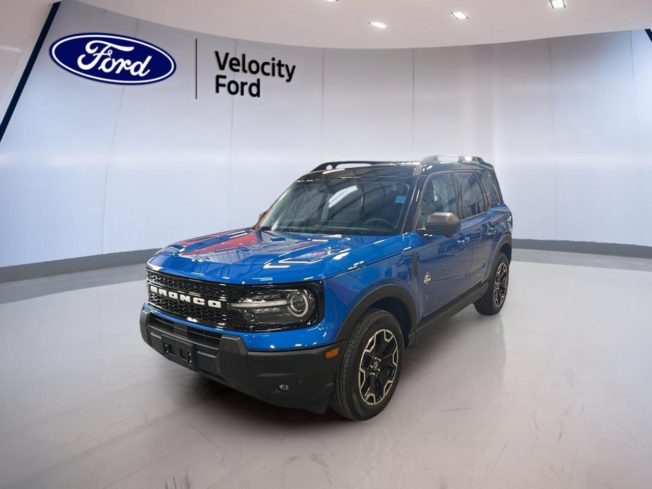 Meet the 2025 Ford Bronco Sport Outer Banks 4x4, a used SUV now at Velocity Ford in Moose Jaw. Finished in Blue with a Blue interior, this four-door model blends everyday comfort with confident utility. With only 7,492 km, automatic transmission, and a 1.5-litre unleaded engine, it is ready for work, travel, and weekend escapes.

This 2025 Ford Bronco Sport Outer Banks 4x4 gives you the sure-footed feel of four-wheel drive and the ease of a compact SUV. It is well equipped with practical features drivers want most, including heated front seats, remote starter, dual-zone climate control, and a backup camera for simple daily use in all seasons.

FEATURES OF THE Bronco Sport Outer Banks 4x4
»» Blue exterior with four-door SUV practicality
»» Automatic transmission with four-wheel drive capability
»» Heated front seats for cold mornings
»» Remote starter adds year-round daily comfort

ADVANCED SAFETY FEATURES
»» Anti-lock braking system helps controlled stops
»» Stability control supports confident road handling
»» Backup camera aids reversing and parking
»» Blind spot monitor boosts lane awareness

PERFORMANCE AND EFFICIENCY
»» 1.5-litre unleaded engine balances daily efficiency
»» Eight-speed automatic supports smooth acceleration
»» Four-wheel drive adds all-season traction
»» Cruise control helps relaxed highway driving

COMFORT AND CONVENIENCE
»» Dual-zone climate control keeps comfort balanced
»» Heated front seats warm winter commutes
»» Power windows simplify everyday operation
»» Push button start adds easy access

TECHNOLOGY AND CONNECTIVITY
»» Bluetooth integration supports hands-free calling
»» Satellite radio expands listening choices
»» Steering wheel audio controls reduce distraction
»» Automatic headlights respond to changing light

CARGO SPACE
»» Rear trunk access makes loading easier
»» Four-door design improves passenger entry
»» Flexible cabin suits daily cargo needs
»» SUV layout supports active lifestyles

AWARDS & RECOGNITIONS
»» Top Safety Pick, Insurance Institute for Highway Safety, 2024

WHAT OTHER OWNERS LIKE
»» Easy-to-drive size for city parking
»» Useful cargo room for daily errands
»» Heated seats improve cold-weather comfort
»» Confident all-wheel capability in poor weather

This Bronco Sport is equipped with many sought-after details that make a difference every day. You will find power steering, heated mirrors, electric mirrors, memory mirrors, tinted windows, fog lights, LED headlamps, tire pressure monitoring, lane departure warning, child safety locks, head side airbags, side impact airbags, driver airbag, passenger airbag, passenger airbag sensor, and automatic door locks.

Inside, this Bronco Sport also adds front air conditioning, automatic climate control, an auto-dimming rearview mirror, illuminated driver and passenger vanity mirrors, drivers seat lumbar support, drivers side power seat, electric passenger seat, memory seats, and an adjustable steering wheel. It is a smart choice for drivers who want comfort, safety, and lasting Ford utility in one well-rounded package.

This 2025 Ford Bronco Sport Outer Banks 4x4s VIN is: 3FMCR9CN1SRF42592.