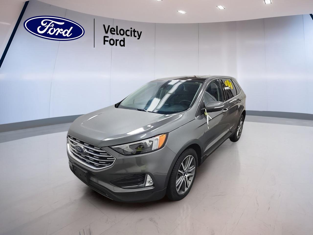// SINGLE OWNER! //

This 2022 Ford Edge Titanium AWD is a smart choice for drivers who want comfort, confidence, and everyday ease in Moose Jaw. CARFAX Canada reports a single owner. Its grey exterior and black interior give it a clean, upscale look, while the 2.0-litre unleaded engine and automatic transmission deliver smooth, capable performance.

With four doors, all-wheel drive confidence, and a well-equipped cabin, this used 2022 Ford Edge Titanium AWD fits busy family life, commuting, and weekend travel with ease. It blends strong road manners with practical utility, helpful driver aids, and premium touches that make every trip feel more refined.

FEATURES OF THE Edge Titanium AWD
»» Standard all-wheel drive for added traction
»» 2.0-litre turbocharged four-cylinder engine
»» Eight-speed automatic transmission for smooth shifts
»» Power liftgate adds daily convenience

ADVANCED SAFETY FEATURES
»» Backup camera helps with safer reversing
»» Blind spot monitor boosts lane awareness
»» Lane departure warning adds extra confidence
»» Multiple airbags support occupant protection

PERFORMANCE AND EFFICIENCY
»» 2.0-litre engine balances power and efficiency
»» Eight-speed automatic supports smooth acceleration
»» All-wheel drive improves year-round traction
»» Stability control helps maintain composed handling

COMFORT AND CONVENIENCE
»» Heated front seats add cold-weather comfort
»» Dual-zone climate control keeps temperatures balanced
»» Remote starter helps warm cabin early
»» Power windows and door locks included

TECHNOLOGY AND CONNECTIVITY
»» Bluetooth integration supports hands-free phone use
»» WiFi hotspot keeps passengers better connected
»» Satellite radio expands entertainment choices
»» Steering wheel audio controls simplify access

CARGO SPACE
»» Power liftgate eases cargo area access
»» Rear trunk access supports daily practicality
»» Four-door layout helps loading passengers easily
»» Useful rear space for errands and gear

AWARDS & RECOGNITIONS
»» Top Safety Pick, Insurance Institute for Highway Safety, 2022

WHAT OTHER OWNERS LIKE
»» Quiet ride on daily commutes
»» Confident all-wheel drive in winter
»» Comfortable front seats for longer trips
»» Easy-to-use technology and controls

This Ford Edge is equipped with many features drivers value every day. Cruise control and power steering help make highway travel easier, while anti-lock braking, stability control, child safety locks, tire pressure monitoring, and automatic headlights add peace of mind on the road.

Inside, this 2022 Ford Edge Titanium AWD offers a refined layout with thoughtful details. You get memory seats, driver lumbar support, a power driver seat, a power passenger seat, an adjustable steering wheel, ambient lighting, an auto-dimming rearview mirror, illuminated vanity mirrors, and front air conditioning.

Exterior convenience is strong as well. Heated mirrors, power mirrors, memory mirrors, turn signal mirrors, tinted windows, fog lights, LED headlamps, a rear spoiler, and a rear window defroster all help this 2022 Ford Edge Titanium AWD feel ready for changing Prairie weather and everyday driving needs.

Entertainment and usability are also well covered. HD Radio, Bluetooth integration, satellite radio, push-button start, remote trunk release, and a backup camera all help make this SUV easy to enjoy. Combined with its single-owner history, this Edge stands out as a versatile and well-equipped used SUV.

This 2022 Ford Edge Titanium AWDs VIN is: 2FMPK4K97NBA49578.
