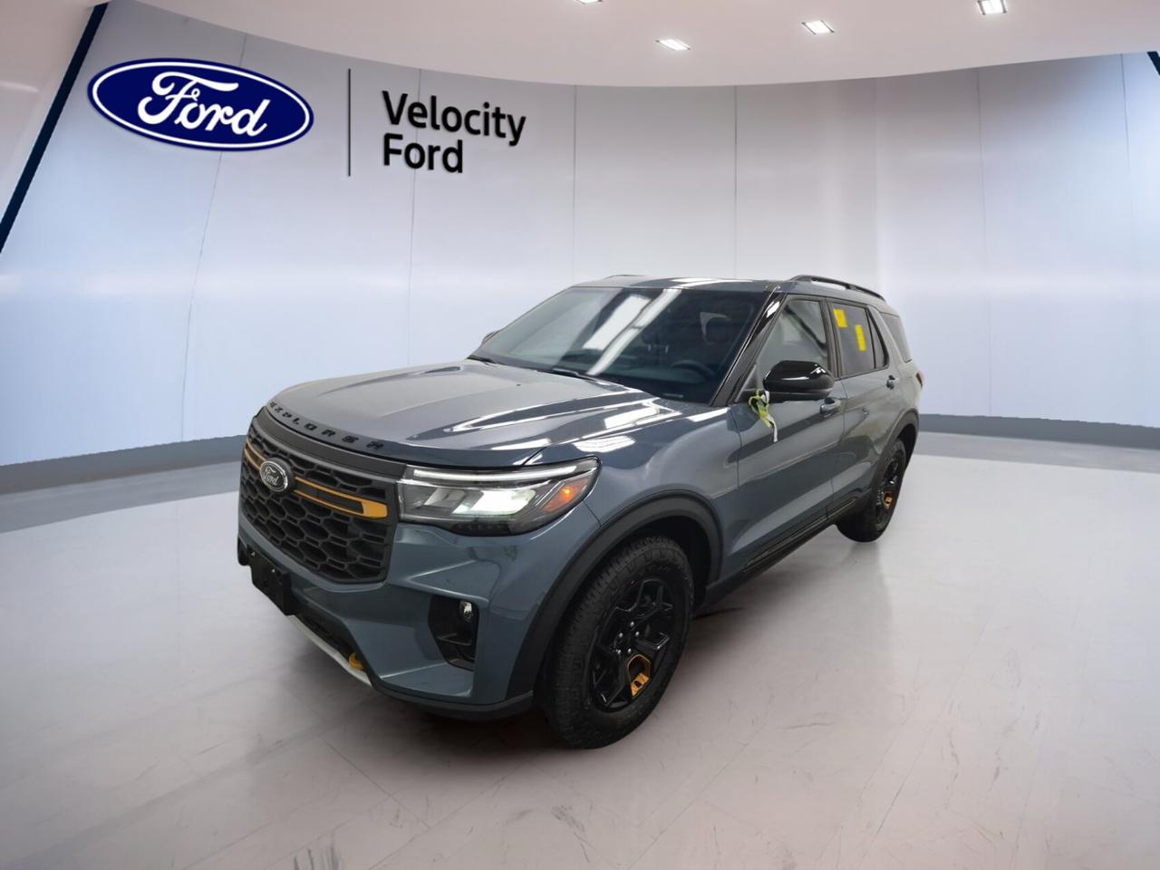 Built for families who want real adventure, this used 2026 Ford Explorer Tremor 4WD at Velocity Ford in Moose Jaw blends rugged confidence with everyday comfort. Its blue exterior, black interior, automatic transmission, and 3.0-litre unleaded engine create a capable SUV with only 4,883 km on the odometer.

The 2026 Ford Explorer Tremor 4WD stands out with four doors, four-wheel drive capability, off-road-ready character, and a smart mix of comfort and technology. It is well equipped for daily commuting, weekend travel, and changing prairie weather, while giving you the space and features drivers expect from a modern Ford SUV.

FEATURES OF THE Explorer Tremor 4WD

»» Off-road tires support added trail confidence
»» Rear tow hook adds useful recovery support
»» Four-wheel drive boosts all-surface traction
»» Limited slip differential aids rough terrain

ADVANCED SAFETY FEATURES

»» Backup camera helps with safer reversing
»» Blind spot monitor adds lane awareness
»» Lane departure warning supports highway confidence
»» Side and head airbags add protection

PERFORMANCE AND EFFICIENCY

»» 3.0-litre unleaded engine delivers strong power
»» Automatic transmission provides smooth daily driving
»» Four-wheel drive improves grip in weather
»» Cruise control supports relaxed highway travel

COMFORT AND CONVENIENCE

»» Heated front and rear seats add comfort
»» Dual-zone climate control helps all passengers
»» Power liftgate makes loading more convenient
»» Remote starter helps in cold mornings

TECHNOLOGY AND CONNECTIVITY

»» Navigation system helps guide every trip
»» Bluetooth integration supports hands-free communication
»» WiFi hotspot keeps devices better connected
»» Satellite radio and HD Radio included

CARGO SPACE

»» Four-door layout allows easy cabin access
»» Rear cargo area suits daily gear
»» Power liftgate simplifies loading and unloading
»» Flexible SUV space fits family needs

WHAT OTHER OWNERS LIKE

»» Strong engine performance feels smooth and confident
»» Spacious cabin works well for families
»» User-friendly technology is easy to operate
»» Comfortable ride suits long daily drives

This 2026 Ford Explorer Tremor 4WD also includes practical features that add value every day. You get power steering, anti-lock braking system, stability control, child safety locks, power windows, heated mirrors, electric mirrors, automatic headlights, fog lights, tinted windows, rear window defroster, and automatic door locks.

Inside, the cabin is designed for comfort and ease of use. Highlights include front air conditioning, automatic climate control, rear climate control, rear air conditioning, adjustable steering wheel, steering wheel audio controls, leather steering wheel, ambient lighting package, push button start, drivers side power seat, electric passenger seat, driver lumbar support, passenger lumbar support, and illuminated vanity mirrors.

This SUV also delivers the modern connectivity many buyers want. Along with GPS navigation, Bluetooth, WiFi hotspot, satellite radio, and HD Radio, it includes LED headlamps for clear visibility and a backup camera for added confidence in tight spaces. Heated rear seats help make colder Canadian days more enjoyable for passengers in back.

With low kilometres, a strong feature list, and the versatile nature of a 2026 Ford Explorer Tremor 4WD, this used SUV is ready for work, travel, and recreation. It offers the toughness expected from Ford along with the comfort and convenience needed for daily life in Moose Jaw and beyond.

This 2026 Ford Explorer Tremor 4WDs VIN is: 1FMWK8JC2TGA02173.