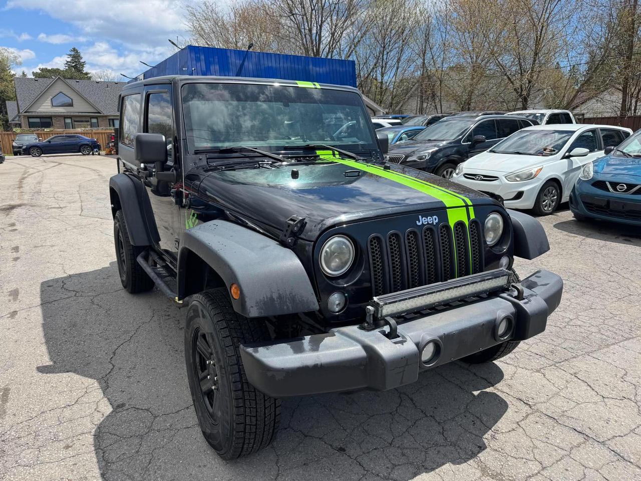 <p>Get ready for adventure with this rugged 2018 Jeep Wrangler Sport 4x4 from Mallory Auto! This iconic black SUV is built for those who crave excitement and arent afraid to tackle any terrain. Whether youre navigating city streets or venturing off the beaten path, this Wranglers classic Jeep styling and legendary 4x4 capability are ready to take you there. The sleek black exterior is sure to turn heads, while the practical gray interior offers a comfortable and durable space for all your journeys.</p><p>Under the hood, youll find a robust 3.6L 6-cylinder engine paired with a manual transmission, giving you complete control and a truly engaging driving experience. This isnt just a vehicle; its an invitation to explore, to embrace the outdoors, and to create unforgettable memories. With 194,884 km on the odometer, this Wrangler has been well-loved and is eager for its next chapter of exploration.</p><p>Here are 5 features that make this 2018 Jeep Wrangler Sport 4x4 a standout at Mallory Auto:</p><ul><li><strong>Legendary 4x4 Capability:</strong> Conquer any trail or weather condition with confidence thanks to Jeeps renowned four-wheel-drive system.</li><li><strong>Engaging Manual Transmission:</strong> Experience a direct connection to the road and a more exhilarating drive with the classic stick shift.</li><li><strong>Iconic Jeep Wrangler Design:</strong> Own a piece of automotive history with the timeless, rugged, and instantly recognizable Wrangler body style.</li><li><strong>Powerful 3.6L V6 Engine:</strong> Unleash ample power and torque for effortless acceleration and towing, no matter where your adventures lead.</li><li><strong>Durable and Functional 2-Door Body:</strong> Perfect for maximizing off-road maneuverability and embracing an open-air driving experience.</li></ul><p><strong><em>Powered by AutoIntelligence&trade;</em></strong></p><p>Vehicle information has been generated using artificial intelligence and is provided for informational purposes only. While efforts are made to ensure accuracy, please confirm all details directly with the dealer.</p>