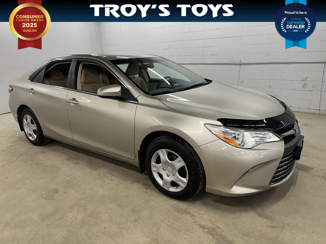 <p>Discover a reliable and comfortable ride with this pre-owned 2016 Toyota Camry LE, available now at Troys Toys! This beige sedan is ready to be your trusted companion for daily commutes and weekend adventures alike. With its classic design and practical features, the Camry LE offers a smooth and efficient driving experience youll appreciate mile after mile. Step inside to find a spacious and inviting beige interior, designed with your comfort in mind.</p><p>This 2016 Camry LE has been well-maintained and has 148,154 kilometers on the odometer, representing a fantastic opportunity to own a renowned vehicle at exceptional value. The automatic transmission and front-wheel drive make for effortless handling, whether youre navigating city streets or cruising on the highway. Its a gasoline-powered, 4-door sedan that perfectly balances practicality with a touch of elegance.</p><p>Here are five features that truly make this Camry LE shine:</p><ul><li><strong>Legendary Toyota Reliability:</strong> Benefit from the peace of mind that comes with Toyotas exceptional reputation for durability and long-term dependability.</li><li><strong>Comfortable Beige Interior:</strong> Enjoy a refined and inviting cabin experience with the subtle elegance of the beige interior, creating a calm and pleasant atmosphere for every journey.</li><li><strong>Smooth Automatic Transmission:</strong> Experience effortless driving with the seamless automatic transmission, making every shift smooth and responsive for a stress-free ride.</li><li><strong>Fuel-Efficient Gasoline Engine:</strong> Get great mileage and keep your fuel costs down with the efficient gasoline engine, a smart choice for both your wallet and the environment.</li><li><strong>Spacious 4-Door Sedan Design:</strong> Perfect for families or individuals needing versatility, the 4-door sedan body style offers easy access and ample room for passengers and cargo.</li></ul><p><strong><em>Powered by AutoIntelligence&trade;</em></strong></p><p>Vehicle information has been generated using artificial intelligence and is provided for informational purposes only. While efforts are made to ensure accuracy, please confirm all details directly with the dealer.</p>
