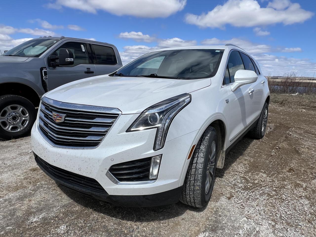 If youre looking for a refined, capable luxury SUV with a thoughtful feature set, this 2018 Cadillac XT5 Luxury AWD delivers exactly that. Finished in striking Crystal White Tricoat over a Black interior, it pairs a twin-clutch all-wheel drive system with a smooth 3.6L V6 and a host of upscale features that make every drive genuinely enjoyable  whether youre commuting or heading out of town.

- Twin-clutch AWD system with driver mode select for confident, responsive handling in all conditions
- Power UltraView double-sized glass sunroof  one of the largest in its class, opening over the first row for an airy, open feel
- Heated leather-wrapped steering wheel and 8-way power passenger seat with 2-way lumbar support for long-haul comfort
- Adaptive Remote Start so the cabin is ready before you are
- Side Blind Zone Alert and Rear Cross-Traffic Alert for added confidence in traffic and parking lots
- Front and Rear Park Assist plus a Rear Vision Camera to make tight spaces stress-free
- Built-in 4G LTE Wi-Fi hotspot capable of connecting up to 7 devices  great for families or frequent travelers
- Power-folding, heated side mirrors with auto-dimming driver side and rear power liftgate with programmable height memory

At 124,500 km, this XT5 has been well used but offers exceptional value in the luxury SUV segment. Visit Merit Ford Sales to experience it in person  book a test drive appointment, reach out with any questions, or get started on your purchase online. Were here to make the process straightforward and worthwhile.
