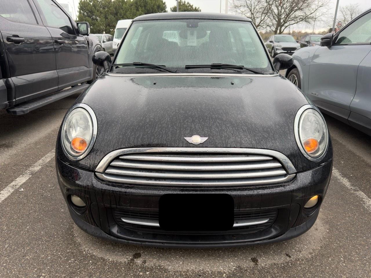 2013 MINI Cooper Cooper MIDNIGHT BLACK | CARBON BLACK CHECKERED CLOTH SEAT TRIM | 6-SPEED MANUAL | BAKER STREET EDITION | BLACK TOP & MIRROR CAPS | 16 X 6.5 BLACK 6-STAR TWIN-SPOKE ALLOY WHLS Photo