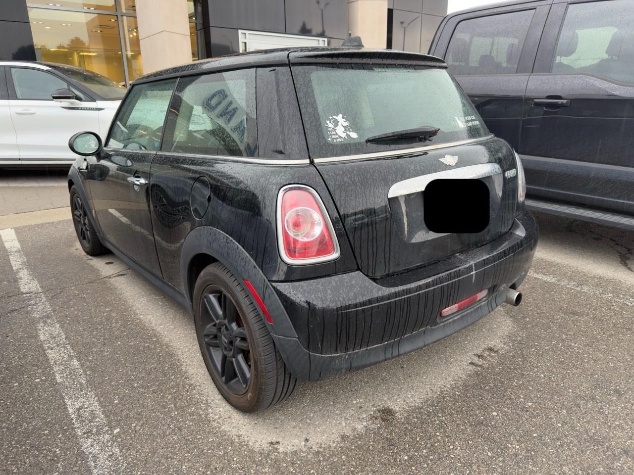 2013 MINI Cooper Cooper MIDNIGHT BLACK | CARBON BLACK CHECKERED CLOTH SEAT TRIM | 6-SPEED MANUAL | BAKER STREET EDITION | BLACK TOP & MIRROR CAPS | 16 X 6.5 BLACK 6-STAR TWIN-SPOKE ALLOY WHLS Photo
