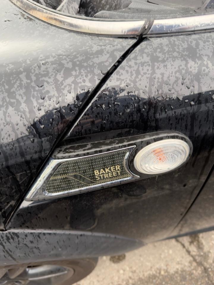 2013 MINI Cooper Cooper MIDNIGHT BLACK | CARBON BLACK CHECKERED CLOTH SEAT TRIM | 6-SPEED MANUAL | BAKER STREET EDITION | BLACK TOP & MIRROR CAPS | 16 X 6.5 BLACK 6-STAR TWIN-SPOKE ALLOY WHLS Photo
