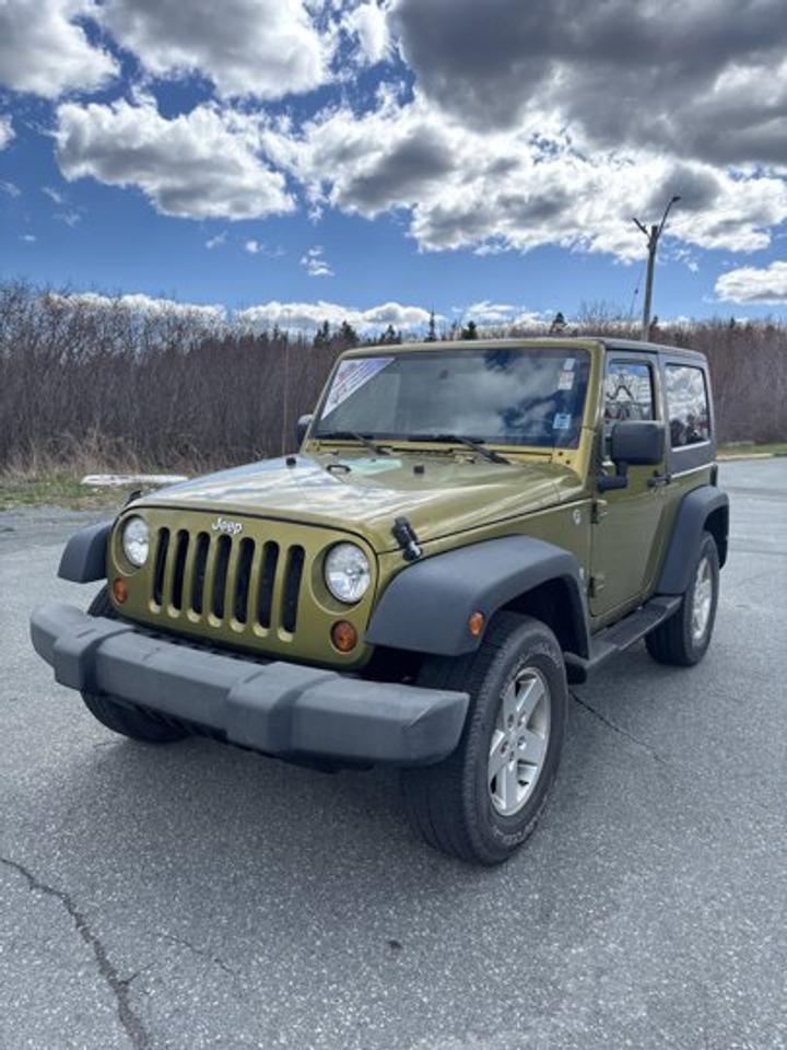 Open-air fun and classic Jeep capability come together in this 2008 Jeep Wrangler X Convertible, now available at Steele Halifax Chrysler Dodge Jeep Ram FIAT in Halifax. Finished in Green with a Grey interior, this two-door Wrangler X brings rugged style, a proven 3.8-litre V6 engine, automatic transmission, and 4-wheel drive for confident driving.With 96,515 km on the odometer, this used 2008 Jeep Wrangler X offers the kind of simple, durable design that has made Wrangler a favourite for years. Its removable roof design adds freedom for sunny drives, while practical features like side steps, aluminum wheels, and a rear window defroster help make daily use easier in changing Canadian weather.FEATURES OF THE Wrangler XRemovable top for open-air freedomTwo-door body with classic Jeep designProven 3.8-litre V6 gas engineAutomatic transmission with 4-wheel driveADVANCED SAFETY FEATURESFour-wheel drive supports traction on loose surfacesRear window defroster aids cold-weather visibilityHigh ground clearance helps on uneven terrainStrong body design built for durabilityPERFORMANCE AND EFFICIENCY3.8-litre V6 delivers dependable powerAutomatic transmission offers easy daily drivingFour-wheel drive adds all-season confidenceGas engine supports proven Wrangler capabilityCOMFORT AND CONVENIENCESunroof adds extra open-sky enjoymentSide steps help cabin entryTwo-door layout keeps access simpleCompact size helps urban manoeuvrabilityTECHNOLOGY AND CONNECTIVITYClear, simple controls are easy to useAutomatic transmission reduces driver workloadRear defroster supports everyday convenienceFunctional cabin layout keeps essentials closeCARGO SPACERear cargo area handles daily gearFlexible space for weekend essentialsCompact body remains practical for errandsCabin storage supports smaller personal itemsAWARDS & RECOGNITIONSBest Resale Value Award, Canadian Black Book, 2008WHAT OTHER OWNERS LIKEOpen-air driving experience with removable roofStrong off-road ability and tractionSimple design with durable characterCompact size for easy trail drivingThis 2008 Jeep Wrangler X is a great fit for drivers who want authentic Jeep character, classic convertible freedom, and dependable four-wheel-drive performance. The Green exterior gives it a bold, outdoors-ready look, while the Grey interior keeps the cabin clean and practical.Its aluminum wheels add a refined touch to the rugged design, and the side steps make getting in and out more convenient. The rear window defroster is a welcome feature in Halifax winters, helping maintain visibility when temperatures drop. The automatic transmission also makes this Wrangler X easier to enjoy in traffic, on weekend drives, or on the way to the cottage.For drivers who want a used SUV with personality, proven mechanical simplicity, and the unmistakable feel of a true Jeep, this 2008 Jeep Wrangler X stands out for all the right reasons. It delivers the fun of a convertible, the confidence of 4-wheel drive, and the enduring appeal of a vehicle built for adventure.This 2008 Jeep Wrangler Xs VIN is: 1J8FA241X8L565042.We invite you to book a viewing and test drive at your earliest convenience