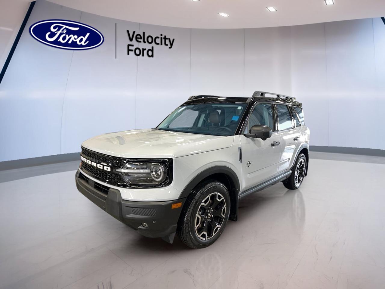 Discover the new 2026 Ford Bronco Sport Outer Banks 4x4 at Velocity Ford in Moose Jaw. This brand new SUV pairs a clean White exterior with a Black interior and a practical 4-door layout. Its 1.5-litre unleaded engine and 8-speed automatic transmission deliver easy daily driving with confident four-wheel-drive capability.

The 2026 Ford Bronco Sport Outer Banks 4x4 is built for drivers who want comfort, smart features, and useful utility in one compact sport utility vehicle. It offers a refined cabin, strong visibility, and everyday versatility, making it a great fit for city trips, highway travel, and changing Prairie weather.

FEATURES OF THE Bronco Sport Outer Banks 4x4

»» White exterior with Black interior  
»» Four-door SUV with automatic transmission  
»» 1.5-litre unleaded engine with 4WD  
»» Brand new at Velocity Ford  

ADVANCED SAFETY FEATURES

»» Backup camera helps with safer reversing  
»» Blind spot monitor adds lane awareness  
»» Lane departure warning supports safer travel  
»» Multiple airbags help protect occupants  

PERFORMANCE AND EFFICIENCY

»» 1.5-litre unleaded engine balances daily efficiency  
»» Eight-speed automatic supports smooth shifting  
»» Four-wheel drive adds all-season confidence  
»» Stability control helps maintain steady handling  

COMFORT AND CONVENIENCE

»» Heated front seats add cold-weather comfort  
»» Dual-zone climate control aids cabin comfort  
»» Remote starter adds everyday convenience  
»» Power seats with memory settings included  

TECHNOLOGY AND CONNECTIVITY

»» Bluetooth integration supports hands-free calling  
»» WiFi hotspot keeps passengers connected  
»» Satellite radio expands entertainment choices  
»» Steering wheel audio controls ease access  

CARGO SPACE

»» Rear trunk access simplifies daily loading  
»» Four-door design improves passenger entry  
»» Flexible SUV layout suits active lifestyles  
»» Useful rear cargo area for gear  

AWARDS & RECOGNITIONS

WHAT OTHER OWNERS LIKE

»» Easy-to-use controls for daily driving  
»» Comfortable ride in varied road conditions  
»» Helpful driver-assist features add confidence  
»» Practical cargo room for everyday needs  

Inside, the 2026 Ford Bronco Sport Outer Banks 4x4 focuses on comfort and ease of use. Front air conditioning, automatic climate control, an adjustable steering wheel, power windows, tinted windows, and illuminated vanity mirrors help make each trip more pleasant. Heated mirrors, electric mirrors, and a rear window defroster also support clear visibility in colder conditions.

This 2026 Ford Bronco Sport Outer Banks 4x4 also brings useful details that drivers appreciate every day. Push-button start, automatic headlights, fog lights, LED headlamps, power steering, automatic door locks, tire pressure monitoring, child safety locks, and an auto-dimming rearview mirror all contribute to a more convenient and reassuring ownership experience.

For peace of mind, the 2026 Ford Bronco Sport Outer Banks 4x4 includes Anti-Lock Braking System, stability control, driver and passenger airbags, side impact airbags, head side airbags, and a passenger airbag sensor. These core safety features work together to support control and occupant protection on busy streets and open highways alike.

This 2026 Ford Bronco Sport Outer Banks 4x4s VIN is: 3FMCR9CN1TRE51064.