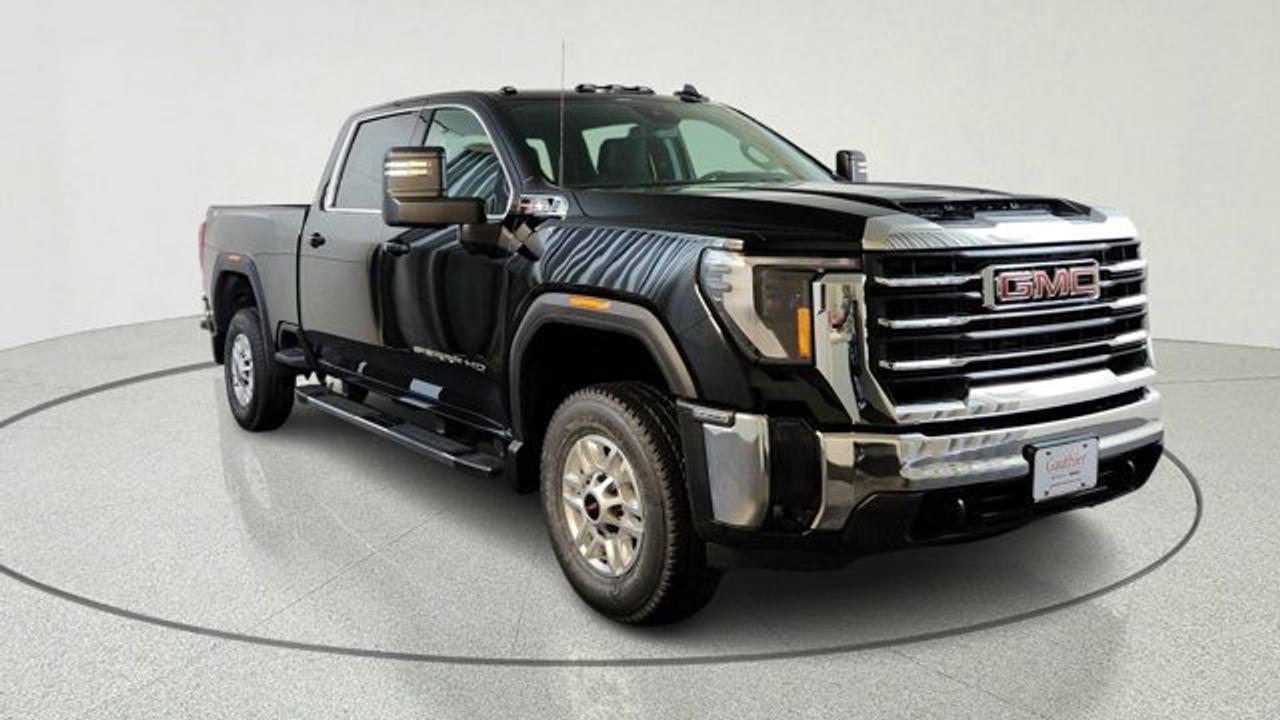 The 2026 GMC Sierra 2500HD SLE is a well-equipped heavy-duty pickup that balances work-ready capability with upgraded comfort and technology, featuring a bold exterior design, multiple cab and bed configurations, and a more refined interior than the base trim. It comes standard with a large 13.4-inch infotainment touchscreen, a 12.3-inch digital driver display, keyless entry with push-button start, and features like a Bose audio system, advanced trailering tech, the MultiPro tailgate and the X31 offroad package. Powered by a standard 6.6-liter V8 gas engine it delivers strong towing performance along with essential safety features such as automatic emergency braking and lane-departure warning.