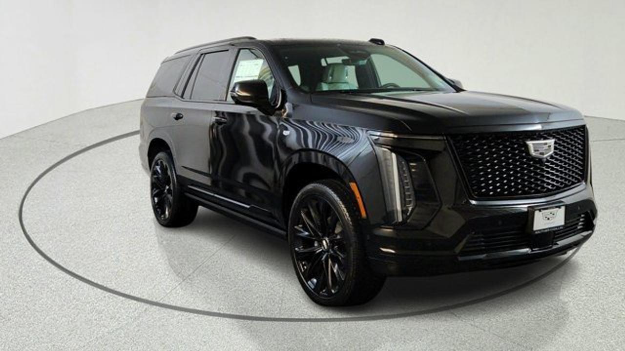 The 2026 Cadillac Escalade is built to impress, featuring a robust 6.2L V8 engine paired with a smooth 10-speed automatic transmission. With four-wheel drive and air-ride adaptive suspension, you can expect a ride that is both powerful and incredibly composed, regardless of the terrain. The Onyx package adds a sleek, bold aesthetic with gloss black accents and striking alloy wheels that ensure you stand out on the road.<br />Inside, the experience is nothing short of exceptional. You are greeted by a massive 55-inch curved front display that brings your navigation and media to life with stunning clarity. From the plush leather seating with massage functions to the immersive AKG studio reference sound system, every detail is designed to provide a first-class experience for both the driver and passengers.<br />Safety and convenience take center stage with advanced technology like Super Cruise for hands-free driving on compatible roads, night vision, and HD surround vision. Whether you are commuting or taking the family on a road trip, this vehicle provides peace of mind through a comprehensive suite of driver-assistance features, including automatic emergency braking and lane-keeping assist.