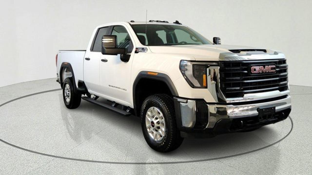 At the heart of this Sierra 2500HD lies a powerful 6.6L V8 gas engine, delivering 401 horsepower and 464 lb-ft of torque. Paired with a smooth-shifting 10-speed automatic transmission and a robust 4-wheel drive system, this truck is designed to provide consistent, reliable performance whether you are hauling heavy equipment or navigating difficult terrain. The fully boxed frame and integrated trailer brake controller ensure you have the confidence needed for serious towing.<br />Inside, the cabin is designed for functionality and long-term durability. It features easy-to-clean vinyl seating and rubberized-vinyl floor covering, making it an excellent choice for work environments. The driver-focused interior includes a user-friendly infotainment system with a 7-inch touchscreen, supporting wireless Apple CarPlay and Android Auto. This setup keeps you connected to your navigation, music, and communications without the clutter of extra cords.