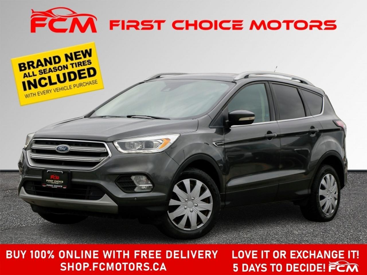 ** ** SPECIAL LIMITED TIME OFFER ** ** PURCHASE ANY VEHICLE THIS WEEK AND RECEIVE 4 BRAND-NEW ALL-SEASON TIRES AT NO ADDITIONAL COST!!! DONT MISS THIS EXCLUSIVE CHANCE TO UPGRADE YOUR RIDE AND STAY PREPARED FOR ANY WEATHER!!!       EXCITING NEWS FROM FIRST CHOICE MOTORS! Our brand-new online showroom is now open to the public, bringing the ultimate car shopping experience right to your fingertips! Enjoy a 100% online car shopping experience, with over 500 certified vehicles in stock, comprehensive protection plans, and thousands of new auto parts & accessories available! Plus, for a limited time, were offering FREE deliveries across Ontario on all vehicle purchases! Dont miss outvisit Shop.fcmotors.ca to find and upgrade your perfect vehicle today!      Welcome to First Choice Motors, the largest car dealership in Toronto of pre-owned cars, SUVs, and vans priced between $5000-$15,000. With an impressive inventory of over 300 vehicles in stock, we are dedicated to providing our customers with a vast selection of affordable and reliable options.       Were thrilled to offer a used 2017 Ford Escape TITANIUM, grey color with 199,000km (STK#9837) This vehicle was $9990 NOW ON SALE FOR $8990. It is equipped with the following features:   - Automatic Transmission   - Leather Seats   - Sunroof   - Heated seats   - Navigation   - All wheel drive   - Bluetooth   - Reverse camera   - Power windows   - Power locks   - Power mirrors   - Air Conditioning      At First Choice Motors, we believe in providing quality vehicles that our customers can depend on. All our vehicles come with a 36-day guarantee on all safety related items. We also offer additional warranty options up to 5 years for our customers who want extra peace of mind.      Furthermore, all our vehicles are sold fully certified with brand new brakes rotors and pads, a fresh oil change, and brand new set of all-season tires installed & balanced. You can be confident that this car is in excellent condition and ready to hit the road.      At First Choice Motors, we believe that everyone deserves a chance to own a reliable and affordable vehicle. Thats why we offer financing options with low interest rates starting at 7.9% O.A.C. Were proud to approve all customers, including those with bad credit, no credit, students, and even 9 socials. Our finance team is dedicated to finding the best financing option for you and making the car buying process as smooth and stress-free as possible.      Our dealership is open 7 days a week to provide you with the best customer service possible. We carry the largest selection of used vehicles for sale under $9990 in all of Ontario. We stock over 300 cars, mostly Hyundai, Chevrolet, Mazda, Honda, Volkswagen, Toyota, Ford, Dodge, Kia, Mitsubishi, Acura, Lexus, and more. With our ongoing sale, you can find your dream car at a price you can afford. Come visit us today and experience why we are the best choice for your next used car purchase!      All prices include $22.00 OMVIC Fee.  Excludes, license plates, ownership registration and ONTARIO HST (13%)   *No Credit Card payments can be accepted for Vehicle Purchases*    *No Credit Card payments can be accepted for Vehicle Purchases*