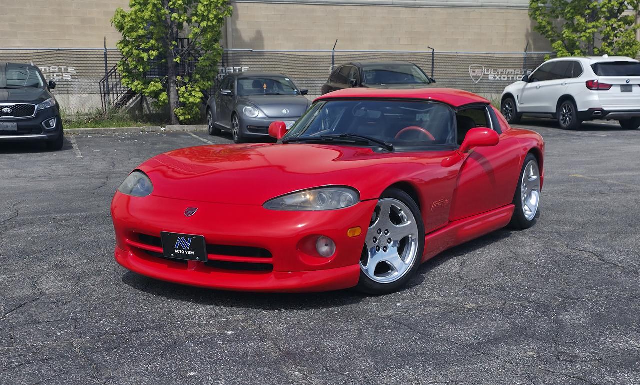 <p dir=ltr>JUST ARRIVED!!</p><p dir=ltr>1996 Dodge Viper RT/10!!</p><p dir=ltr>**HARDTOP CONVERTIBLE**</p><p dir=ltr><strong>Paint Code:</strong> Viper Red (PRN)</p><p dir=ltr>The 1996 Dodge Viper is a pivotal, high-performance American sports car, featuring the iconic 8.0L V10 engine, 415 horsepower (RT/10), and a 6-speed manual transmission. It introduced the coupe (RT/10) with its famous double-bubble roof and moved the exhaust to the rear.</p><p dir=ltr><strong>Key Highlights for 1996:</strong></p><p dir=ltr><strong>Performance:</strong> The 1996 Viper RT/10 produces 415 hp and 490 lb-ft of torque, with 0-60 mph in 3.9 seconds and a top speed of 190 mph.</p><p dir=ltr><strong>Generations:</strong> 1996 is considered the start of the SR II (second generation), featuring a more refined, rigid chassis and lighter aluminum suspension components.</p><p dir=ltr><strong>RT/10 Roadster Updates:</strong> The 1996 roadster retained its open-top design but saw power increases to 415 hp and moved from side-pipes to rear-exiting exhausts</p><p dir=ltr><strong>1996 Dodge Viper Key Specs:</strong></p><p dir=ltr><strong>Engine:</strong> 8.0L V10 (Naturally Aspirated)</p><p dir=ltr><strong>Transmission:</strong> 6-speed Manual</p><p dir=ltr><strong>Power:</strong> 415 hp (RT/10)</p><p dir=ltr><strong>Torque:</strong> 488-490 lb-ft</p><p dir=ltr><strong>Weight:</strong> ~3,300&ndash;3,400 lbs</p><p dir=ltr><strong>0&ndash;60 MPH:</strong> ~3.9 seconds</p><p dir=ltr style=line-height: 1.2; margin-top: 12pt; margin-bottom: 12pt;>&nbsp;</p><p dir=ltr style=line-height: 1.2; margin-top: 12pt; margin-bottom: 12pt;>&nbsp;</p><p dir=ltr style=line-height: 1.2; margin-top: 12pt; margin-bottom: 12pt;><span style=font-size: 11pt; font-family: Roboto,sans-serif; color: #000000; background-color: transparent; font-weight: 400; font-style: italic; font-variant: normal; text-decoration: none; vertical-align: baseline; white-space: pre-wrap;>**VEHICLE BEING SOLD ON CONSIGNMENT** </span></p><p dir=ltr style=line-height: 1.2; margin-top: 12pt; margin-bottom: 12pt;><span style=font-size: 11pt; font-family: Roboto,sans-serif; color: #000000; background-color: transparent; font-weight: 400; font-style: italic; font-variant: normal; text-decoration: none; vertical-align: baseline; white-space: pre-wrap;>FINANCING AND LEASING AVAILABLE ON ALL CERTIFIED VEHICLES.</span></p><p dir=ltr style=line-height: 1.2; margin-top: 12pt; margin-bottom: 12pt;><span style=font-size: 11pt; font-family: Roboto,sans-serif; color: #000000; background-color: transparent; font-weight: 400; font-style: italic; font-variant: normal; text-decoration: none; vertical-align: baseline; white-space: pre-wrap;>HST and Licensing Fees are to be charged on all vehicles.&nbsp;</span></p><p dir=ltr style=line-height: 1.2; margin-top: 12pt; margin-bottom: 12pt;><span style=font-size: 11pt; font-family: Roboto,sans-serif; color: #000000; background-color: transparent; font-weight: 400; font-style: italic; font-variant: normal; text-decoration: none; vertical-align: baseline; white-space: pre-wrap;>All CERTIFIED vehicles come with a 36-day Safety Guarantee.</span></p><p dir=ltr style=line-height: 1.2; margin-top: 12pt; margin-bottom: 12pt;><span style=font-size: 11pt; font-family: Roboto,sans-serif; color: #000000; background-color: transparent; font-weight: 400; font-style: italic; font-variant: normal; text-decoration: none; vertical-align: baseline; white-space: pre-wrap;>ALL CERTIFIED VEHICLES COME WITH A BRONZE GLOBAL WARRANTY (3 MONTH / 3,000 KM / $1,000 PER CLAIM)</span></p><p dir=ltr style=line-height: 1.2; margin-top: 12pt; margin-bottom: 12pt;><span style=font-size: 11pt; font-family: Roboto,sans-serif; color: #000000; background-color: transparent; font-weight: 400; font-style: italic; font-variant: normal; text-decoration: none; vertical-align: baseline; white-space: pre-wrap;>EXTENDED GLOBAL WARRANTY OPTIONS AVAILABLE ON ALL CERTIFIED VEHICLES.</span></p><p dir=ltr style=line-height: 1.2; margin-top: 12pt; margin-bottom: 12pt;><span style=font-size: 11pt; font-family: Roboto,sans-serif; color: #000000; background-color: transparent; font-weight: 400; font-style: italic; font-variant: normal; text-decoration: none; vertical-align: baseline; white-space: pre-wrap;>Auto View is located at 590 South Service Road Stoney Creek, only minutes off the QEW Exit 83 Fruitland Road!</span></p><p dir=ltr style=line-height: 1.2; margin-top: 12pt; margin-bottom: 12pt;><span style=font-size: 11pt; font-family: Roboto,sans-serif; color: #000000; background-color: transparent; font-weight: 400; font-style: italic; font-variant: normal; text-decoration: none; vertical-align: baseline; white-space: pre-wrap;>Contact us VIA email, call, or text!</span></p><p dir=ltr style=line-height: 1.2; margin-top: 12pt; margin-bottom: 12pt;><span style=font-size: 11pt; font-family: Roboto,sans-serif; color: #000000; background-color: transparent; font-weight: 400; font-style: italic; font-variant: normal; text-decoration: none; vertical-align: baseline; white-space: pre-wrap;>sales@autoview.ca</span></p><p style=line-height: 1.2;><span id=docs-internal-guid-dc6619b1-7fff-14fb-1847-6df547af7f68></span></p><p dir=ltr style=line-height: 1.2; margin-top: 12pt; margin-bottom: 12pt;><span style=font-size: 11pt; font-family: Roboto,sans-serif; color: #000000; background-color: transparent; font-weight: 400; font-style: italic; font-variant: normal; text-decoration: none; vertical-align: baseline; white-space: pre-wrap;>905-379-4206</span></p>