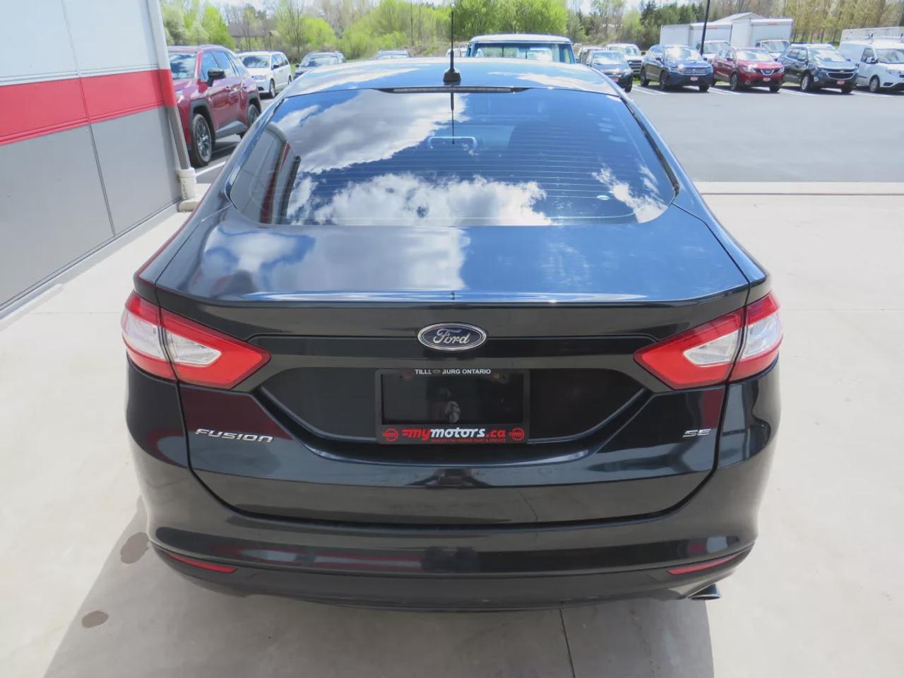 2014 Ford Fusion SE | Clean Title No Accidents | Alloy Rims | Tints | Digital Touchscreen | Reverse Camera | CD Player | Photo