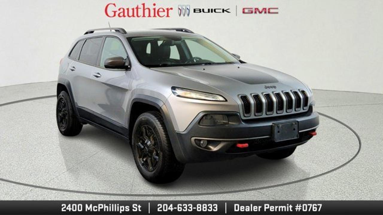 This 2015 Jeep Cherokee delivers strong performance with its 3.2L V6 engine paired to a smooth 9-speed automatic transmission and Jeep Active Drive II 4WD system. It handles Winnipeg winters and nearby trails thanks to off-road suspension, skid plates, and a locking rear differential. Youll appreciate the towing setup with a Class III hitch and wiring for trailers.<br />Inside, enjoy black Nappa leather seats, dual-zone climate control, and a power liftgate for easy loading. Tech shines with the Uconnect 8.4-inch touchscreen, GPS navigation, and 9 speakers with subwoofer. Comfort features like heated seats and a heated steering wheel from the Cold Weather Group keep you cozy year-round. Safety stands out with blind-spot monitoring, rear park assist, and a backup camera.