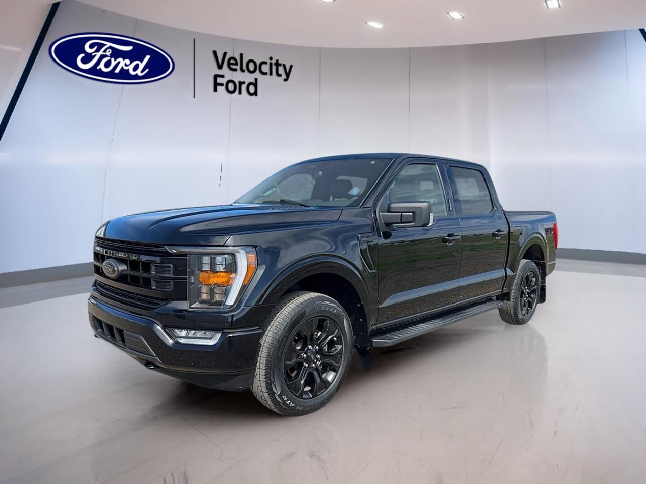 Built to handle work, weekends, and Canadian weather, this 2022 Ford F-150 XLT 4WD SuperCrew 5.5 Box With Leather  delivers proven capability with a practical crew cab layout. Finished in Black with a Black interior, it offers four full doors, automatic transmission, and a 3.5-litre unleaded engine.

With 109,980 km, this used pickup at Velocity Ford in Moose Jaw is equipped with the features that matter most for daily driving and jobsite confidence. Four-wheel drive, off-road tires, navigation, blind spot monitoring, and a backup camera help make every trip easier, whether you are towing, commuting, or heading out of town.

FEATURES OF THE F-150 XLT 4WD SuperCrew 5.5 Box With Leather 
»» 3.5-litre unleaded engine with automatic transmission
»» SuperCrew cab with four full doors
»» Four-wheel drive for added traction
»» 5.5-foot box for versatile hauling

TRUCK FEATURES
»» Tows up to 4,580 kg confidently
»» Rear tow hook supports truck utility
»» Off-road tires add extra traction
»» SuperCrew cab boosts passenger versatility

ADVANCED SAFETY FEATURES
»» Backup camera helps with reversing visibility
»» Blind spot monitor adds lane awareness
»» Lane departure warning supports safer travel
»» Side and head airbags included

PERFORMANCE AND EFFICIENCY
»» 3.5-litre unleaded engine delivers solid power
»» Automatic transmission supports smooth shifting
»» Dual shift mode adds control
»» Four-wheel drive handles changing conditions

COMFORT AND CONVENIENCE
»» Cruise control helps on long drives
»» Front air conditioning keeps cabin comfortable
»» Driver and passenger lumbar support
»» Power windows and automatic door locks

TECHNOLOGY AND CONNECTIVITY
»» Navigation system offers clear route guidance
»» Bluetooth integration supports hands-free calling
»» WiFi hotspot keeps devices connected
»» Steering wheel audio controls add ease

CARGO SPACE
»» 5.5-foot box handles everyday hauling
»» Rear trunk access improves loading convenience
»» Four-door cab supports passenger and gear
»» Spare tire adds roadside reassurance

AWARDS & RECOGNITIONS
»» North American Truck of the Year, North American Car, Truck and Utility Vehicle of the Year, 2021
»» Best Buy Award, The Car Guide, 2022

WHAT OTHER OWNERS LIKE
»» Strong towing and everyday truck capability
»» Spacious SuperCrew cabin for family use
»» Smooth ride for a full-size pickup
»» Useful technology for work and travel

This 2022 Ford F-150 XLT 4WD SuperCrew 5.5 Box With Leather COMING SOON gives you the strength of a full-size truck with the comfort and connectivity drivers want every day. Key features like ABS, stability control, child safety locks, heated mirrors, electric mirrors, fog lights, tire pressure monitoring, satellite radio, and automatic headlights add value where it counts.

It is a smart choice for drivers who need a truck that can tow, carry, and stay comfortable through changing road conditions. From errands in Moose Jaw to highway travel and trailering duties, this F-150 is ready to get the job done with confidence.

This 2022 Ford F-150 XLT 4WD SuperCrew 5.5 Box With Leather  VIN is: 1FTFW1E80NFB48425.