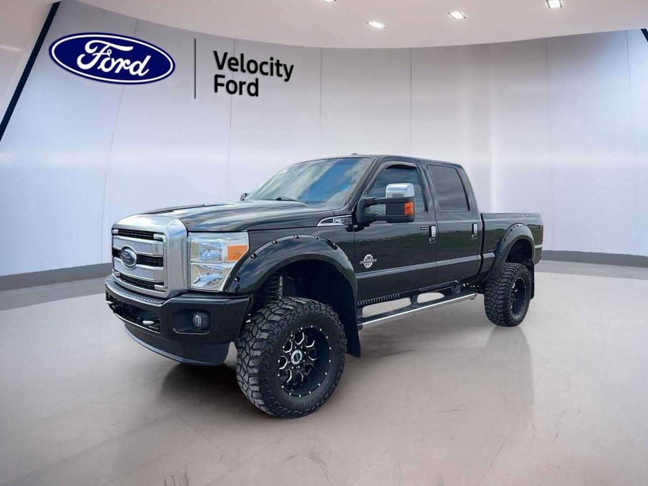 Built to handle hard work with confidence, this used 2014 Ford Super Duty F-350 SRW 4WD Crew Cab 6-3/4 Ft Box Lariat delivers diesel strength, crew cab comfort, and proven capability. Finished in Black with a Black interior, it has 209,369 km and an automatic transmission. At Velocity Ford in Moose Jaw, this truck is ready for towing, hauling, and daily duty.

FEATURES OF THE Super Duty F-350 SRW 4WD Crew Cab 6-3/4 Ft Box Lariat
»» Black exterior with matching Black interior
»» Crew cab with four full doors
»» Automatic diesel power for heavy work
»» Lariat trim adds premium comfort touches

TRUCK FEATURES
»» Towing capacity rated at 5,488 kg
»» Four-wheel drive boosts traction off-road
»» Rear tow hook adds jobsite utility
»» Side steps ease cab entry

ADVANCED SAFETY FEATURES
»» Anti-lock braking system helps controlled stops
»» Stability control supports secure road handling
»» Backup camera aids reversing in tight spaces
»» Multiple airbags add occupant protection

PERFORMANCE AND EFFICIENCY
»» 6.7-litre diesel engine delivers strong torque
»» Six-speed automatic supports smooth power delivery
»» Limited slip differential improves traction control
»» Off-road tires support rugged terrain travel

COMFORT AND CONVENIENCE
»» Dual-zone climate control adds cabin comfort
»» Heated front and rear seats
»» Memory settings add daily driving ease
»» Power windows and power steering included

TECHNOLOGY AND CONNECTIVITY
»» Bluetooth integration supports hands-free communication
»» Satellite radio expands listening choices
»» HD Radio improves audio clarity
»» Steering wheel audio controls add convenience

CARGO SPACE
»» 6-3/4-foot box supports useful hauling
»» Crew cab balances passengers and gear
»» Rear access helps load smaller items
»» Spare tire adds roadside peace

AWARDS & RECOGNITIONS
»» Best Resale Value, full-size pickup, Kelley Blue Book, 2014
»» Brand Image Award, best truck brand, Kelley Blue Book, 2014

WHAT OTHER OWNERS LIKE
»» Strong diesel towing power for heavy jobs
»» Comfortable cabin for long highway drives
»» Four-wheel drive confidence in rough weather
»» Useful crew cab space for families

This 2014 Ford Super Duty F-350 SRW 4WD Crew Cab 6-3/4 Ft Box Lariat offers the kind of capability many truck buyers want most. Heated mirrors, electric mirrors, retractable mirrors, tinted windows, fog lights, automatic headlights, adjustable pedals, and an auto-dimming rearview mirror add everyday practicality. Driver and passenger power seats, lumbar support, cruise control, and automatic door locks help make each trip easier.

This 2014 Ford Super Duty F-350 SRW 4WD Crew Cab 6-3/4 Ft Box Lariat also brings useful details for life in Canada. The rear window defroster helps in cold weather, while tire pressure monitoring supports smart maintenance. Child safety locks and passenger airbag sensing add reassurance. For drivers who need a dependable diesel truck with comfort-focused equipment, this Ford stands out as a capable choice.

This 2014 Ford Super Duty F-350 SRW 4WD Crew Cab 6-3/4 Ft Box Lariats VIN is: 1FT8W3BT5EEB10580.