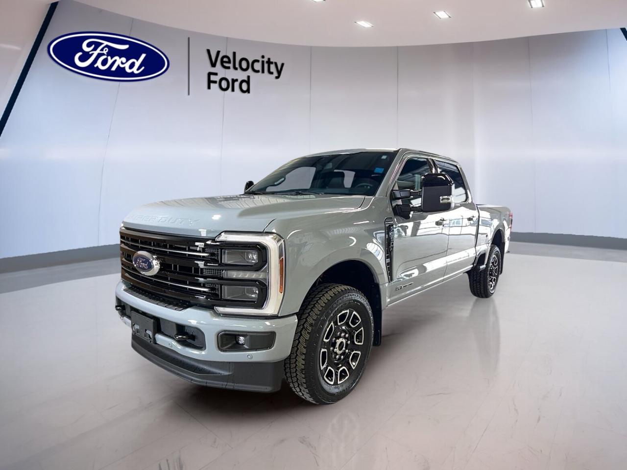 Built for hard work and long hauls, this brand new 2026 Ford Super Duty F-350 SRW Platinum 4WD Crew Cab 6.75 Box is ready to impress in Moose Jaw. Its Grey exterior, Black interior, four full doors, and powerful 6.7-litre diesel engine create a premium heavy-duty truck with real purpose.

At Velocity Ford, this new 2026 Ford Super Duty F-350 SRW Platinum 4WD Crew Cab 6.75 Box blends upscale comfort with serious capability. Automatic transmission, Four-Wheel Drive, off-road tires, power retractable running boards, and a 17,900 kg towing capacity make it ready for work, travel, and demanding Canadian conditions.

FEATURES OF THE Super Duty F-350 SRW Platinum 4WD Crew Cab 6.75 Box

»» Premium Platinum trim with diesel power
»» Crew Cab with four full doors
»» Short box supports versatile daily hauling
»» Four-Wheel Drive for confident traction

TRUCK FEATURES

»» Tows up to 17,900 kg confidently
»» Rear tow hook supports heavy-duty recovery
»» Limited slip differential aids tough terrain
»» Off-road tires boost worksite traction

ADVANCED SAFETY FEATURES

»» Backup camera helps with safer reversing
»» Blind spot monitor adds lane awareness
»» Lane departure warning supports highway driving
»» Side and head airbags enhance protection

PERFORMANCE AND EFFICIENCY

»» 6.7-litre diesel delivers strong pulling power
»» Automatic transmission offers smooth gear changes
»» Four-Wheel Drive boosts traction in weather
»» Anti-Lock Braking System supports controlled stops

COMFORT AND CONVENIENCE

»» Heated front and rear seats add comfort
»» Dual-zone climate control keeps temperatures balanced
»» Remote starter helps in cold mornings
»» Power retractable running boards ease entry

TECHNOLOGY AND CONNECTIVITY

»» Navigation system guides every trip clearly
»» Bluetooth integration supports hands-free communication
»» WiFi hotspot keeps devices connected
»» Head-Up Display shows key driving data

CARGO SPACE

»» 6.75-foot box handles daily cargo needs
»» Rear trunk access helps loading convenience
»» Crew Cab adds secure in-cabin storage
»» Spare tire supports remote job confidence

WHAT OTHER OWNERS LIKE

»» Strong diesel torque for towing confidence
»» Comfortable cabin for long workdays
»» Useful driver aids for easier travel
»» High-end features with truck capability

This heavy-duty Ford also adds everyday luxury with heated mirrors, electric mirrors, power windows, front air conditioning, tinted windows, memory seats, memory mirrors, adjustable pedals, adjustable steering wheel, leather steering wheel, steering wheel audio controls, auto-dimming rearview mirror, rear window defroster, and automatic door locks.

Convenience and visibility are well covered in this new 2026 Ford Super Duty F-350 SRW Platinum 4WD Crew Cab 6.75 Box. It includes LED headlamps, fog lights, automatic headlights, turn signal mirrors, retractable mirrors, push button start, satellite radio, HD Radio, and cruise control for easy highway travel.

This truck also supports driver control with power steering, stability control, tire pressure monitoring, driver power seat, passenger power seat, driver lumbar support, passenger lumbar support, passenger airbag sensor, child safety locks, and illuminated vanity mirrors for both front occupants.

This 2026 Ford Super Duty F-350 SRW Platinum 4WD Crew Cab 6.75 Boxs VIN is: 1FT8W3BT0TEE42665.