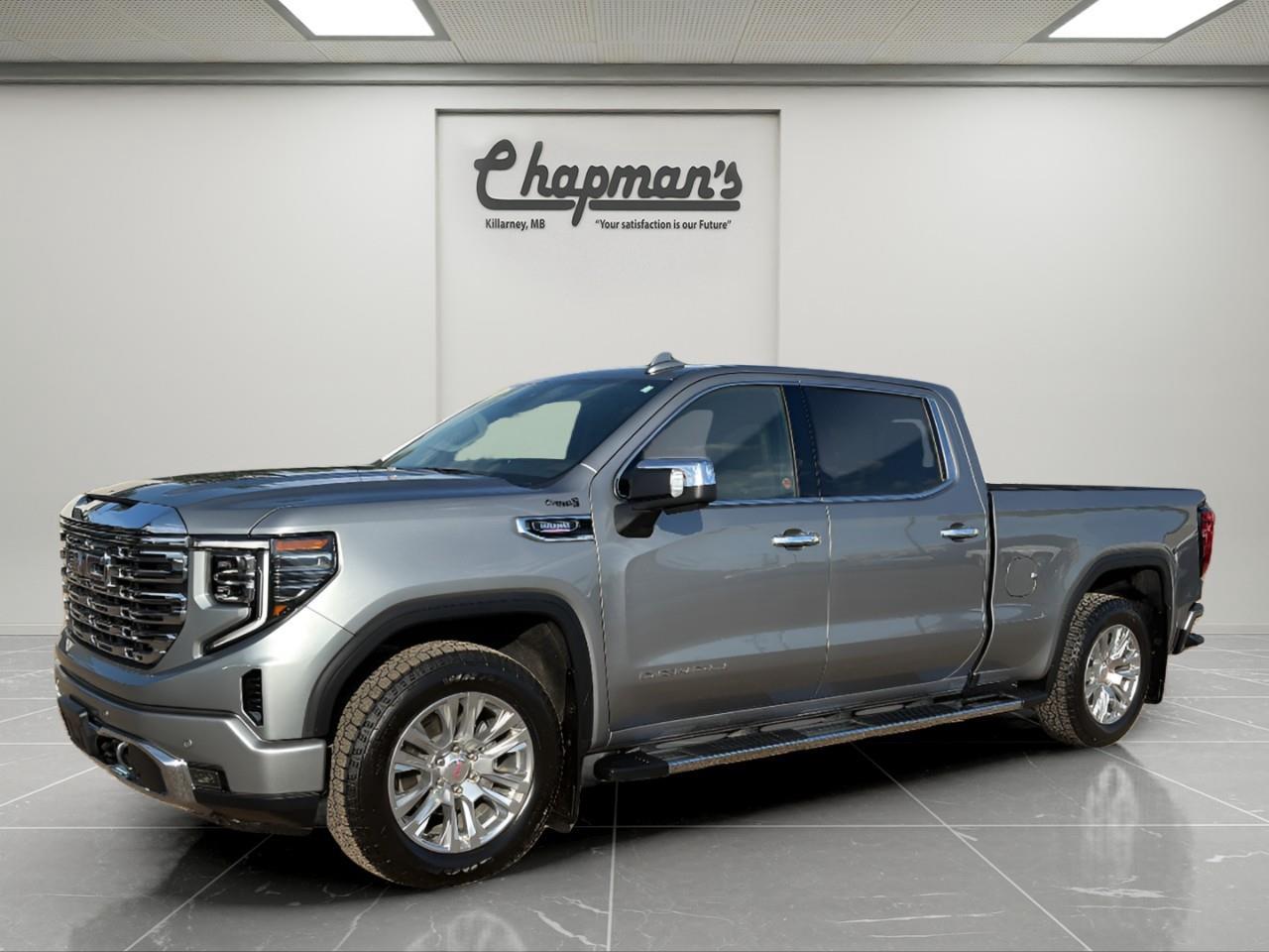 <p>Finished in Sterling Metallic with a Jet Black interior, this 2025 GMC Sierra 1500 Denali Crew Cab 4WD delivers premium luxury, advanced technology, and impressive diesel efficiency in a refined full-size truck. Combining Denali craftsmanship with serious towing capability and upscale comfort, this Sierra is built for drivers who want professional-grade performance without sacrificing refinement.</p><p>Powered by the Duramax 3.0L Turbo-Diesel engine paired with a 10-speed automatic transmission, this Sierra delivers exceptional torque, smooth highway performance, and impressive fuel efficiency. Equipped with a 2-speed Autotrac transfer case, adaptive ride control suspension, and advanced trailering technology, its ready for towing, hauling, and long-distance travel alike.</p><h3>Performance & Capability</h3><ul><li><p>Duramax 3.0L Turbo-Diesel engine</p></li><li><p>10-speed automatic transmission</p></li><li><p>4WD with 2-speed Autotrac transfer case</p></li><li><p>Denali Premium Suspension with Adaptive Ride Control</p></li><li><p>Auto-locking rear differential</p></li><li><p>Trailering package</p></li><li><p>Integrated trailer brake controller</p></li><li><p>Stabilitrak with trailer sway control and hill start assist</p></li><li><p>Dual exhaust system</p></li><li><p>120V cargo bed and interior power outlets</p></li></ul><h3>Interior Comfort & Convenience</h3><ul><li><p>Heated and ventilated front bucket seats</p></li><li><p>Heated second-row outboard seats</p></li><li><p>12-way power front seats</p></li><li><p>Driver seat and mirror memory</p></li><li><p>Heated leather-wrapped steering wheel</p></li><li><p>Power tilt and telescoping steering column</p></li><li><p>Wireless charging</p></li><li><p>Adaptive cruise control</p></li><li><p>Rear window defogger</p></li><li><p>Power sunroof</p></li><li><p>Remote start and keyless open</p></li></ul><h3>Technology & Connectivity</h3><ul><li><p>GMC Premium Infotainment System with 13.4" touchscreen</p></li><li><p>Google built-in compatibility with navigation capability</p></li><li><p>Wireless Apple CarPlay & Android Auto</p></li><li><p>12.3" digital driver information centre</p></li><li><p>Bose premium sound system</p></li><li><p>In-vehicle trailering app</p></li><li><p>OnStar One connected services</p></li><li><p>SiriusXM capability</p></li><li><p>Technology Package</p></li><li><p>Rear camera mirror</p></li><li><p>Multicolour 15" head-up display</p></li><li><p>Bluetooth connectivity</p></li></ul><h3>Safety & Driver Assistance</h3><ul><li><p>Enhanced automatic emergency braking</p></li><li><p>Forward collision alert</p></li><li><p>Front pedestrian braking</p></li><li><p>Lane keep assist with lane departure warning</p></li><li><p>Trailer side blind zone alert</p></li><li><p>Rear cross traffic braking</p></li><li><p>Rear pedestrian alert</p></li><li><p>HD surround vision with bed view</p></li><li><p>Front and rear park assist</p></li><li><p>Following distance indicator</p></li><li><p>IntelliBeam automatic high beams</p></li><li><p>Safety alert seat</p></li><li><p>Tire pressure monitoring with tire fill alert</p></li></ul><h3>Exterior Highlights</h3><ul><li><p>Sterling Metallic exterior</p></li><li><p>Chrome assist steps</p></li><li><p>GMC MultiPro tailgate</p></li><li><p>Spray-on bedliner</p></li><li><p>LED headlamps, fog lamps, and taillamps</p></li><li><p>LED cargo area lighting</p></li><li><p>Power folding heated mirrors with driver-side auto-dimming</p></li><li><p>Rain-sensing wipers</p></li><li><p>Dual exhaust outlets</p></li></ul><p>A premium diesel-powered truck that combines Denali luxury, advanced trailering technology, and impressive towing capability for work, travel, and everyday driving.</p><p>Price Includes Dealer Fee.</p><p>Price Excludes PST & GST.</p><p>Financing Options Available, Call For More Details.</p><p>3 Year/60,000 kilometer* Base Warranty Coverage</p><p>5 Year/100,000 kilometer* Powertrain Component Warranty Coverage</p><p>5 Year/100,000 kilometer* Courtesy Transportation and 24/7 Roadside Assistance</p><p>6 Year/160,000 kilometer* Sheet Metal (Rust Through) Perforation Warranty Coverage</p><p>*Whichever Comes First.</p> <p><strong>*While every reasonable effort is made to ensure the accuracy of this information, we are not responsible for any error or omissions contained on these pages. Please verify any information in question with Chapman Motors Ltd.</strong></p>