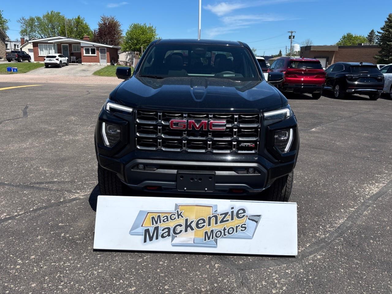 2026 GMC Canyon AT4 New 5 Passenger Mid Size 4X4 Truck with a Power Sunroof, Power Front Seats, Heated and Cooled Front Seats, Heated Steering Wheel, Adaptive Cruise Control, Heads Up Drivers Display, and a 11 Diagonal T Photo
