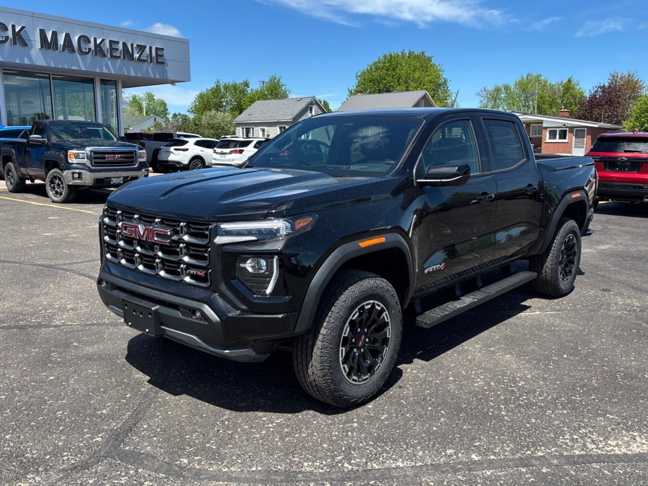2026 GMC Canyon AT4 New 5 Passenger Mid Size 4X4 Truck with a Power Sunroof, Power Front Seats, Heated and Cooled Front Seats, Heated Steering Wheel, Adaptive Cruise Control, Heads Up Drivers Display, and a 11 Diagonal T Photo4