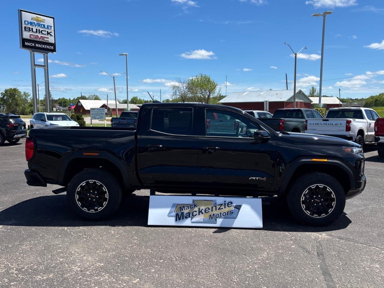 2026 GMC Canyon AT4 New 5 Passenger Mid Size 4X4 Truck with a Power Sunroof, Power Front Seats, Heated and Cooled Front Seats, Heated Steering Wheel, Adaptive Cruise Control, Heads Up Drivers Display, and a 11 Diagonal T Photo
