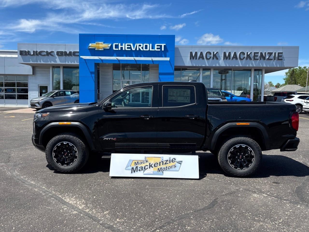 2026 GMC Canyon AT4 New 5 Passenger Mid Size 4X4 Truck with a Power Sunroof, Power Front Seats, Heated and Cooled Front Seats, Heated Steering Wheel, Adaptive Cruise Control, Heads Up Drivers Display, and a 11 Diagonal T Photo