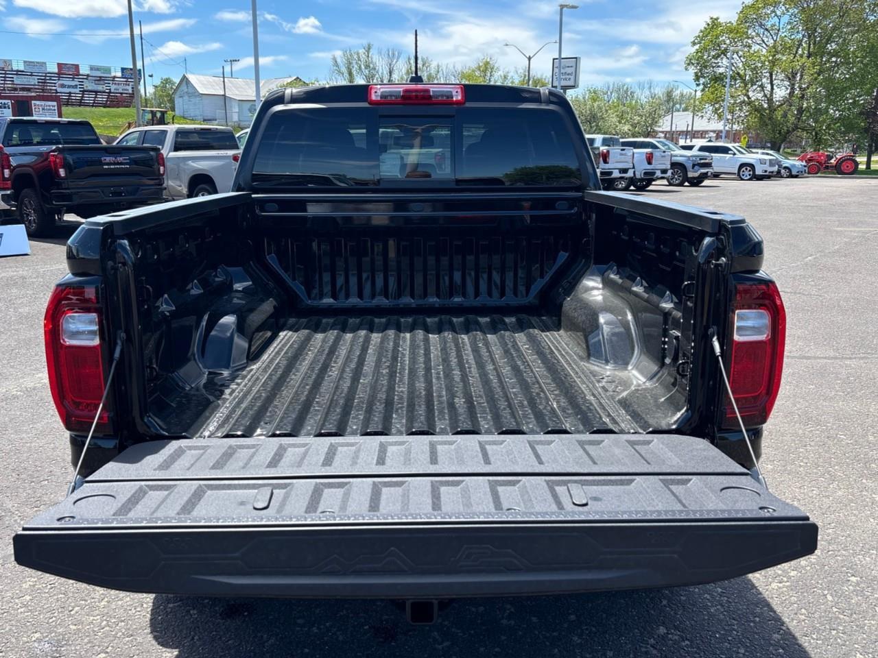 2026 GMC Canyon AT4 New 5 Passenger Mid Size 4X4 Truck with a Power Sunroof, Power Front Seats, Heated and Cooled Front Seats, Heated Steering Wheel, Adaptive Cruise Control, Heads Up Drivers Display, and a 11 Diagonal T Photo