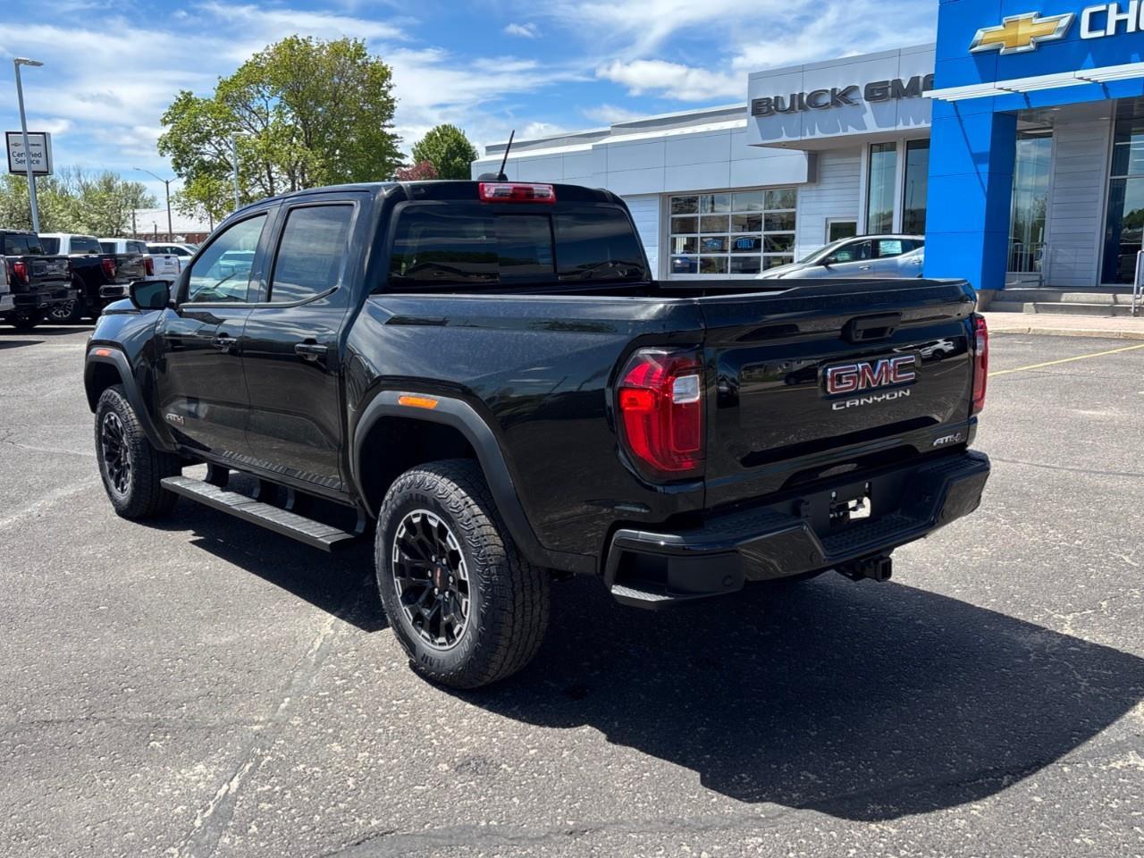 2026 GMC Canyon AT4 New 5 Passenger Mid Size 4X4 Truck with a Power Sunroof, Power Front Seats, Heated and Cooled Front Seats, Heated Steering Wheel, Adaptive Cruise Control, Heads Up Drivers Display, and a 11 Diagonal T Photo