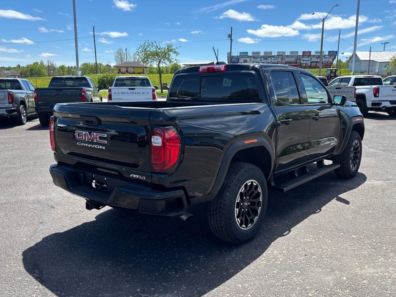 2026 GMC Canyon AT4 New 5 Passenger Mid Size 4X4 Truck with a Power Sunroof, Power Front Seats, Heated and Cooled Front Seats, Heated Steering Wheel, Adaptive Cruise Control, Heads Up Drivers Display, and a 11 Diagonal T Photo