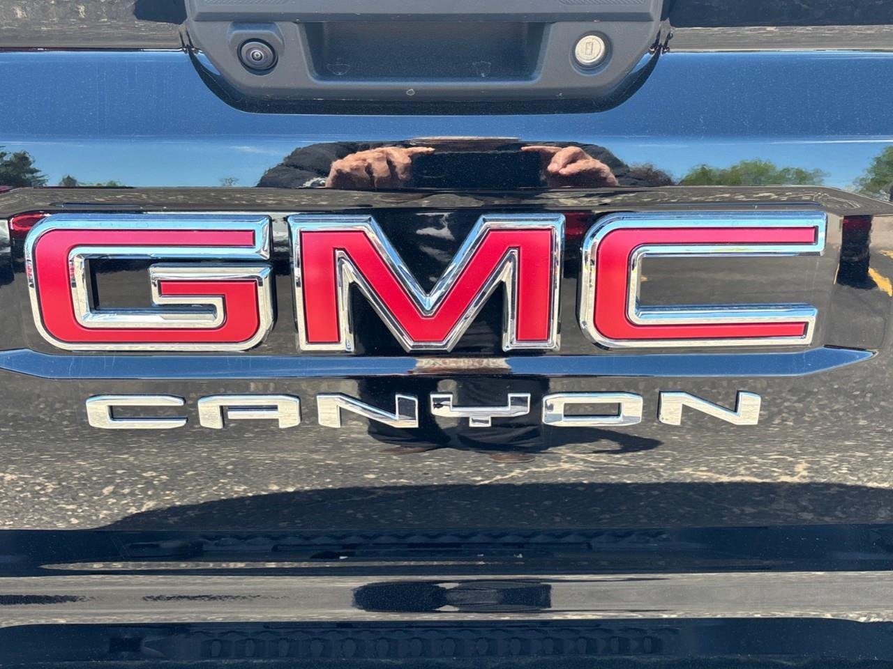 2026 GMC Canyon AT4 New 5 Passenger Mid Size 4X4 Truck with a Power Sunroof, Power Front Seats, Heated and Cooled Front Seats, Heated Steering Wheel, Adaptive Cruise Control, Heads Up Drivers Display, and a 11 Diagonal T Photo