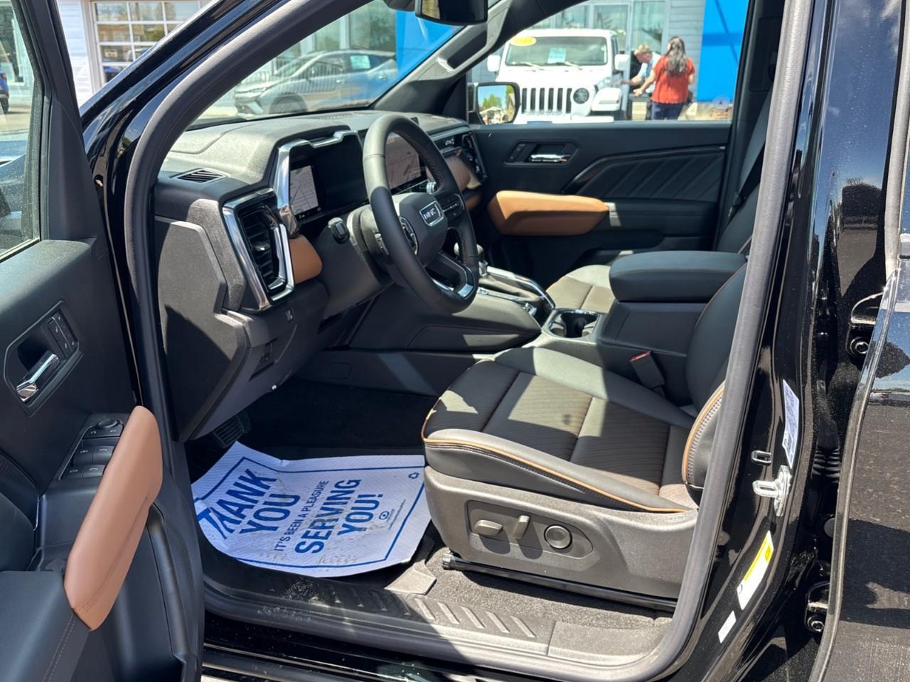 2026 GMC Canyon AT4 New 5 Passenger Mid Size 4X4 Truck with a Power Sunroof, Power Front Seats, Heated and Cooled Front Seats, Heated Steering Wheel, Adaptive Cruise Control, Heads Up Drivers Display, and a 11 Diagonal T Photo