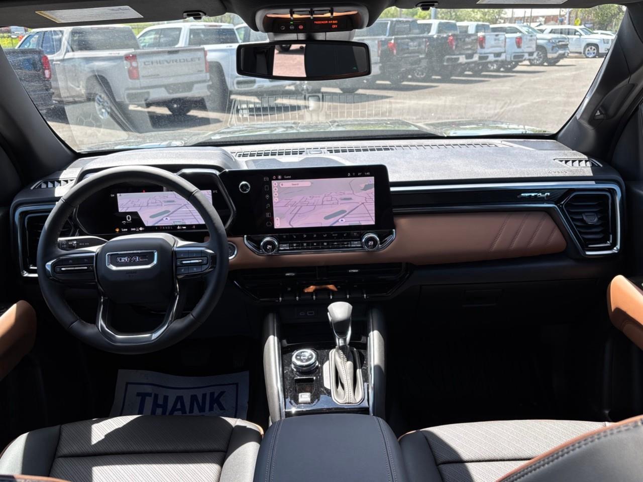 2026 GMC Canyon AT4 New 5 Passenger Mid Size 4X4 Truck with a Power Sunroof, Power Front Seats, Heated and Cooled Front Seats, Heated Steering Wheel, Adaptive Cruise Control, Heads Up Drivers Display, and a 11 Diagonal T Photo