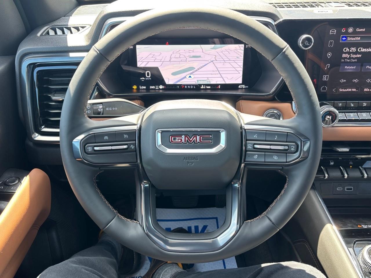 2026 GMC Canyon AT4 New 5 Passenger Mid Size 4X4 Truck with a Power Sunroof, Power Front Seats, Heated and Cooled Front Seats, Heated Steering Wheel, Adaptive Cruise Control, Heads Up Drivers Display, and a 11 Diagonal T Photo