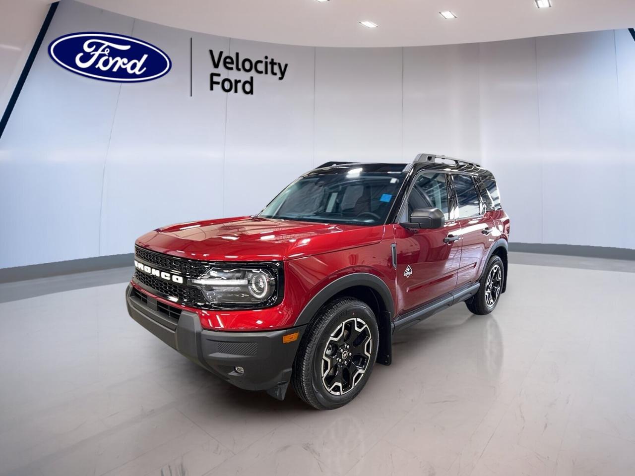 This brand new 2026 Ford Bronco Sport Outer Banks 4x4 is ready for life in Moose Jaw with confident capability, smart comfort, and everyday ease. Finished in Red with a Black interior, this four-door SUV blends rugged Ford utility with a refined feel. Its automatic transmission and 1.5 litre unleaded engine make daily driving smooth and simple.

The 2026 Ford Bronco Sport Outer Banks 4x4 suits drivers who want real four-wheel-drive confidence, modern safety, and practical versatility. At Velocity Ford, this new SUV stands out with heated front seats, remote start, dual-zone climate control, and a full set of key driver-assist features for added peace of mind.

FEATURES OF THE Bronco Sport Outer Banks 4x4

»» Four-wheel drive for year-round road confidence
»» Red exterior with bold Bronco styling
»» Black interior with upscale everyday comfort
»» Eight-speed automatic for smooth response

ADVANCED SAFETY FEATURES

»» Backup camera helps with reversing visibility
»» Blind spot monitor adds lane awareness
»» Lane departure warning supports safer travel
»» Side and head airbags enhance protection

PERFORMANCE AND EFFICIENCY

»» 1.5 litre unleaded engine balances efficiency
»» Eight-speed automatic supports smooth shifting
»» Four-wheel drive improves traction on surfaces
»» Stability control helps maintain composed handling

COMFORT AND CONVENIENCE

»» Heated front seats add cold-weather comfort
»» Remote starter warms cabin before driving
»» Dual-zone climate control improves cabin comfort
»» Memory seat settings add daily convenience

TECHNOLOGY AND CONNECTIVITY

»» Bluetooth integration supports hands-free communication
»» Wi-Fi hotspot keeps devices connected
»» Satellite radio expands entertainment choices
»» Steering wheel audio controls simplify access

CARGO SPACE

»» Rear trunk access makes loading easier
»» Four-door layout supports passenger flexibility
»» Cargo area suits daily gear well
»» Useful storage for errands and travel

WHAT OTHER OWNERS LIKE

»» Easy driving size for daily use
»» Useful cargo room for active lifestyles
»» Confident four-wheel-drive capability year-round
»» Comfortable ride with practical tech

This new Ford SUV also includes power steering, anti-lock braking system, child safety locks, cruise control, power windows, heated mirrors, electric mirrors, automatic headlights, fog lights, tinted windows, tire pressure monitoring, push button start, automatic door locks, rear window defroster, and an auto-dimming rearview mirror.

Driver comfort is enhanced with an adjustable steering wheel, drivers seat lumbar support, drivers side power seat, electric passenger seat, illuminated drivers side vanity mirror, illuminated passenger vanity mirror, front air conditioning, automatic climate control, and ambient lighting. These features help make each drive more pleasant in every season.

For added confidence, this vehicle is equipped with driver airbag, passenger airbag, passenger airbag sensor, side impact airbags, head side airbags, and stability control. The LED headlamps add clear lighting and a modern look, while memory mirrors bring extra convenience to your routine.

This 2026 Ford Bronco Sport Outer Banks 4x4s VIN is: 3FMCR9CN4TRE50779.