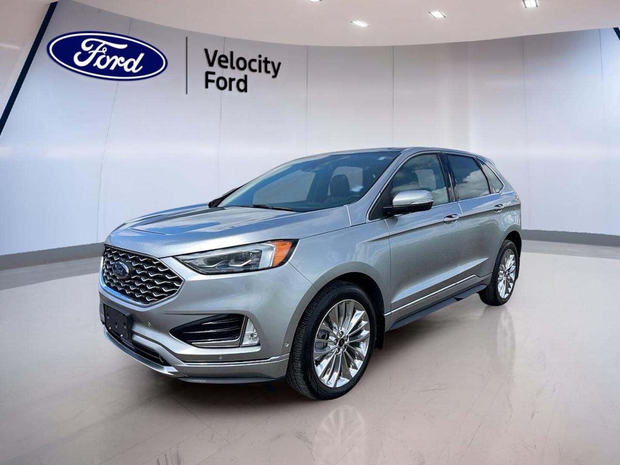 // SINGLE OWNER! //

Meet the 2022 Ford Edge Titanium AWD  a well-equipped midsize SUV built for comfort, confidence, and everyday ease. Finished in Silver with a Black interior, this four-door Ford has had a single owner, as reported by CARFAX Canada, and shows 46,396 km on the odometer.

This 2022 Ford Edge Titanium AWD pairs a responsive 2.0-litre unleaded engine with an 8-speed automatic transmission and all-wheel drive for secure year-round travel. It offers a refined drive in Moose Jaw, with useful features that make commuting, family trips, and weekend errands simple and enjoyable.

FEATURES OF THE Edge Titanium AWD 
»» All-wheel drive for added road confidence
»» 2.0-litre engine with smooth automatic shifting
»» Silver exterior with black interior styling
»» Four-door SUV practicality for daily use

ADVANCED SAFETY FEATURES
»» Backup camera helps with easier reversing
»» Lane departure warning adds driving support
»» Blind spot monitor boosts lane awareness
»» Side and head airbags enhance protection

PERFORMANCE AND EFFICIENCY
»» 2.0-litre engine balances power and efficiency
»» 8-speed automatic supports smooth acceleration
»» All-wheel drive improves traction in Canada
»» Stability control helps maintain composed handling

COMFORT AND CONVENIENCE
»» Heated front seats add cold-weather comfort
»» Dual-zone climate control keeps temperatures balanced
»» Remote starter warms cabin before departure
»» Power liftgate simplifies cargo area access

TECHNOLOGY AND CONNECTIVITY
»» Bluetooth integration supports hands-free phone use
»» WiFi hotspot keeps passengers better connected
»» HD Radio expands entertainment choices
»» Steering wheel audio controls aid convenience

CARGO SPACE
»» Rear trunk access makes loading easier
»» Power liftgate helps with busy routines
»» SUV design offers flexible everyday utility
»» Four doors improve passenger and cargo access

AWARDS & RECOGNITIONS
»» Top Safety Pick, Insurance Institute for Highway Safety, 2022

WHAT OTHER OWNERS LIKE
»» Quiet ride quality for daily driving
»» Comfortable seating and easy road manners
»» Useful technology that feels simple to use
»» Confident all-wheel drive in poor weather

This Ford Edge is equipped with many practical details that drivers value every day. Cruise control, power steering, anti-lock braking system, stability control, child safety locks, power windows, heated mirrors, electric mirrors, automatic headlights, fog lights, tinted windows, and a rear spoiler all add to its appeal.

Inside, this 2022 Ford Edge Titanium AWD  focuses on comfort and driver ease. You get front air conditioning, automatic climate control, dual-zone climate control, memory seats, a power driver seat, power passenger seat, driver lumbar support, an adjustable steering wheel, a leather steering wheel, ambient lighting, and illuminated vanity mirrors.

This 2022 Ford Edge Titanium AWD  also brings smart convenience to your routine. Push-button start, remote trunk release, automatic door locks, turn signal mirrors, rear window defroster, tire pressure monitoring, satellite radio, and a spare tire help make each trip more practical and reassuring.

With its single-owner history, capable all-wheel drive system, and strong list of comfort, safety, and connectivity features, this Ford Edge is a smart choice for drivers who want a well-rounded used SUV from Velocity Ford in Moose Jaw.

This 2022 Ford Edge Titanium AWD  VIN is: 2FMPK4K96NBA11372.