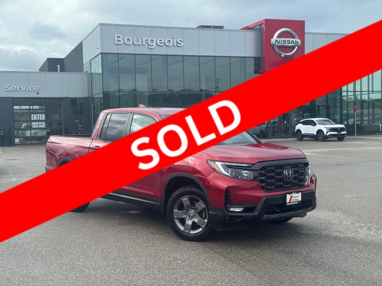 <p>The 2025 Honda Ridgeline TrailSport AWD in a striking red exterior stands out with its robust all-wheel drive capability and smooth automatic transmission. This truck combines rugged performance with sophisticated handling, making it a reliable choice for any terrain.</p><p>From the exterior, its eye-catching red shade is complemented by stylish alloy wheels. Step inside to experience luxury with premium leather seats and a leather-wrapped heated steering wheel that speaks to both comfort and elegance. The spacious interior is designed for convenience and utility, featuring power seats, heated front and rear seats, and power windows to tailor to every passenger's comfort. The integration of a sunroof or moonroof enhances the presence of natural light, elevating the cabins ambiance.</p><p>Technologically advanced, this Ridgeline is equipped with cutting-edge features like smart device integration and a satellite radio to keep you entertained on the go. Stay connected with the Bluetooth connection, and benefit from the convenience of a remote start system. Its suite of advanced safety features includes a backup camera, parking sensors, lane assist, and adaptive cruise control to ensure peace of mind in every journey.</p><p>The Honda Ridgeline TrailSport is an ideal choice for outdoor enthusiasts and adventure seekers who crave a balance between capability and luxury. Don't miss the chance to experience this versatile truckcontact our dealership today for more information and let us assist you in making it your own.</p> <p><strong>Why Choose the Bourgeois Auto Group?</strong></p><p>For 80 years, Bourgeois Auto Group has been delivering exceptional automotive experiences. Our factor trained teams work to ensure you receive the shopping experience you deserve; whether you're looking for a new or new-to-you vehicle.</p><p>Shop 24/7 with our online showroom and chat service, ensuring convenience every step of the way. No hidden fees, full disclosure, and every pre-owned vehicle comes with a Carfax® report for peace of mind.</p><p>We offer a wide selection of pre-owned vehicles, all competitively priced using real-time market data. Get the best deal on your purchase and trade-in with our free Live Market Analysis report.</p><p>Looking to sell your car? We buy any make or modelno purchase required. Our simple to use online trade valuation tool will provide you with a clear, transparent selling experience whether you buy our car or not.</p><p>Backed by hundreds dedicated employees across 4 convenient locations, were here to meet all your automotive needs. Visit us in Midland or Parry Sound and explore our inventory or schedule your next service today.</p> <p><strong>Financing Your Next Vehicle with Bourgeois Midland Nissan:</strong></p><p>At Bourgeois Midland Nissan, we make financing your next vehicle simple and stress-free! Our team works with trusted lenders to find flexible options tailored to your budget. Drive away with confidenceapply today!</p><p>Take advantage of our online pre-qualification tool, backed by Equifax and TD Bank to find the payment that works for you. Simply <a href=https://www.bourgeoisnissan.com/pre-qualify-for-financing/ rel=nofollow><strong>CLICK HERE</strong></a> to use our secure online credit tool with no impact to your credit.</p>