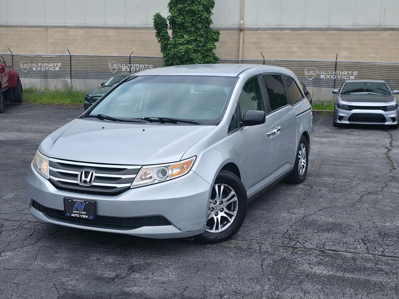 <p dir=ltr>JUST ARRIVED!!</p><p dir=ltr>2012 Honda Odyssey EX</p><p dir=ltr>GREAT FAMILY CAR!!</p><p dir=ltr>The 2012 Honda Odyssey EX is a mid-tier trim level of Hondas popular fourth-generation family minivan, striking a highly practical balance between affordability and essential comfort upgrades.</p><p dir=ltr><strong>Trim Level Upgrades:</strong></p><p dir=ltr>Positioned directly above the base LX model, the EX trim adds several notable comfort, tech, and convenience features:</p><p dir=ltr><strong>Dual Power Sliding Doors:</strong> Upgrades from the manual sliding doors on the LX.</p><p dir=ltr><strong>Seating Capacity:</strong> Expands capacity to 8 passengers (instead of 7) by adding a multi-functional second-row middle seat.</p><p dir=ltr><strong>Upgraded Wheels:</strong> Standard 17-inch aluminum alloy wheels replace the base steel wheels.</p><p dir=ltr><strong>Tri-Zone Climate Control:</strong> Includes automatic control for the driver, front passenger, and rear cabin.</p><p dir=ltr><strong>Technology Upgrades:</strong> Standard integrated Bluetooth for hands-free calling/audio, a larger 8-inch multi-information center display, a USB audio interface, and a 2-GB CD library storage system.</p><p dir=ltr><strong>Added Comforts:</strong> Heated front seats (standard on Canadian models), integrated second-row window sunshades, a removable front centre console, and a flip-up trash bag ring.</p><p dir=ltr><strong>Core Specifications:</strong></p><p dir=ltr><strong>Engine:</strong> 3.5-litre V6 producing 248 horsepower and 250 lb-ft of torque.</p><p dir=ltr><strong>Transmission:</strong> 5-speed automatic.</p><p dir=ltr><strong>Fuel Economy:</strong> Estimated at roughly 12.4 L/100km city / 8.7 L/100km highway.</p><p dir=ltr><strong>Cargo Space:</strong> Offers 38.4 cubic feet behind the 3rd row, expandable to a massive 148.5 cubic feet with the 3rd row stowed and 2nd row removed.</p><p dir=ltr><strong>Towing Capacity:</strong> Up to 3,500 lbs when properly equipped.</p><p dir=ltr style=line-height: 1.2; margin-top: 12pt; margin-bottom: 12pt;>&nbsp;</p><p dir=ltr style=line-height: 1.2; margin-top: 12pt; margin-bottom: 12pt;><span style=font-size: 11pt; font-family: Roboto,sans-serif; color: #000000; background-color: transparent; font-weight: 400; font-style: italic; font-variant: normal; text-decoration: none; vertical-align: baseline; white-space: pre-wrap;>FINANCING AND LEASING AVAILABLE ON ALL CERTIFIED VEHICLES.</span></p><p dir=ltr style=line-height: 1.2; margin-top: 12pt; margin-bottom: 12pt;><span style=font-size: 11pt; font-family: Roboto,sans-serif; color: #000000; background-color: transparent; font-weight: 400; font-style: italic; font-variant: normal; text-decoration: none; vertical-align: baseline; white-space: pre-wrap;>HST and Licensing Fees are to be charged on all vehicles.&nbsp;</span></p><p dir=ltr style=line-height: 1.2; margin-top: 12pt; margin-bottom: 12pt;><span style=font-size: 11pt; font-family: Roboto,sans-serif; color: #000000; background-color: transparent; font-weight: 400; font-style: italic; font-variant: normal; text-decoration: none; vertical-align: baseline; white-space: pre-wrap;>All CERTIFIED vehicles come with a 36-day Safety Guarantee.</span></p><p dir=ltr style=line-height: 1.2; margin-top: 12pt; margin-bottom: 12pt;><span style=font-size: 11pt; font-family: Roboto,sans-serif; color: #000000; background-color: transparent; font-weight: 400; font-style: italic; font-variant: normal; text-decoration: none; vertical-align: baseline; white-space: pre-wrap;>ALL CERTIFIED VEHICLES COME WITH A BRONZE GLOBAL WARRANTY (3 MONTH / 3,000 KM / $1,000 PER CLAIM)</span></p><p dir=ltr style=line-height: 1.2; margin-top: 12pt; margin-bottom: 12pt;><span style=font-size: 11pt; font-family: Roboto,sans-serif; color: #000000; background-color: transparent; font-weight: 400; font-style: italic; font-variant: normal; text-decoration: none; vertical-align: baseline; white-space: pre-wrap;>EXTENDED GLOBAL WARRANTY OPTIONS AVAILABLE ON ALL CERTIFIED VEHICLES.</span></p><p dir=ltr style=line-height: 1.2; margin-top: 12pt; margin-bottom: 12pt;><span style=font-size: 11pt; font-family: Roboto,sans-serif; color: #000000; background-color: transparent; font-weight: 400; font-style: italic; font-variant: normal; text-decoration: none; vertical-align: baseline; white-space: pre-wrap;>Auto View is located at 590 South Service Road Stoney Creek, only minutes off the QEW Exit 83 Fruitland Road!</span></p><p dir=ltr style=line-height: 1.2; margin-top: 12pt; margin-bottom: 12pt;><span style=font-size: 11pt; font-family: Roboto,sans-serif; color: #000000; background-color: transparent; font-weight: 400; font-style: italic; font-variant: normal; text-decoration: none; vertical-align: baseline; white-space: pre-wrap;>Contact us VIA email, call, or text!</span></p><p dir=ltr style=line-height: 1.2; margin-top: 12pt; margin-bottom: 12pt;><span style=font-size: 11pt; font-family: Roboto,sans-serif; color: #000000; background-color: transparent; font-weight: 400; font-style: italic; font-variant: normal; text-decoration: none; vertical-align: baseline; white-space: pre-wrap;>sales@autoview.ca</span></p><p style=line-height: 1.2;><span id=docs-internal-guid-4ac04223-7fff-914d-3829-742cb49c2e1a></span></p><p dir=ltr style=line-height: 1.2; margin-top: 12pt; margin-bottom: 12pt;><span style=font-size: 11pt; font-family: Roboto,sans-serif; color: #000000; background-color: transparent; font-weight: 400; font-style: italic; font-variant: normal; text-decoration: none; vertical-align: baseline; white-space: pre-wrap;>905-379-4206</span></p>