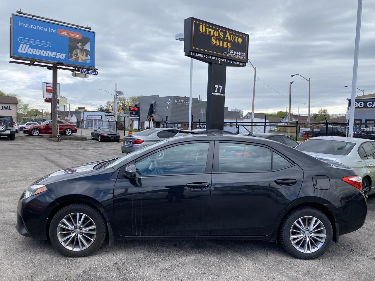 2014 Toyota Corolla 4dr Sdn CVT LE Photo