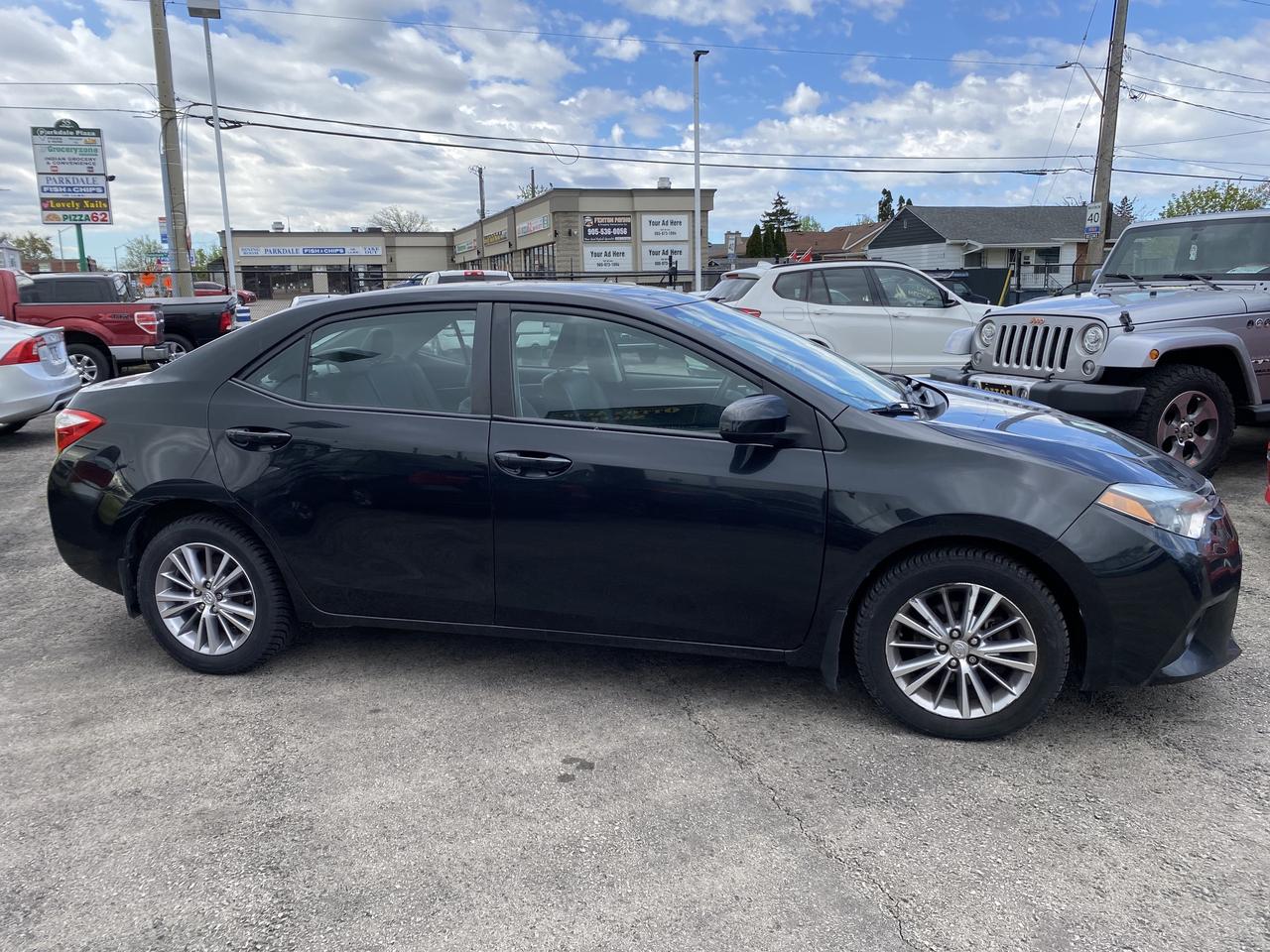 2014 Toyota Corolla 4dr Sdn CVT LE Photo