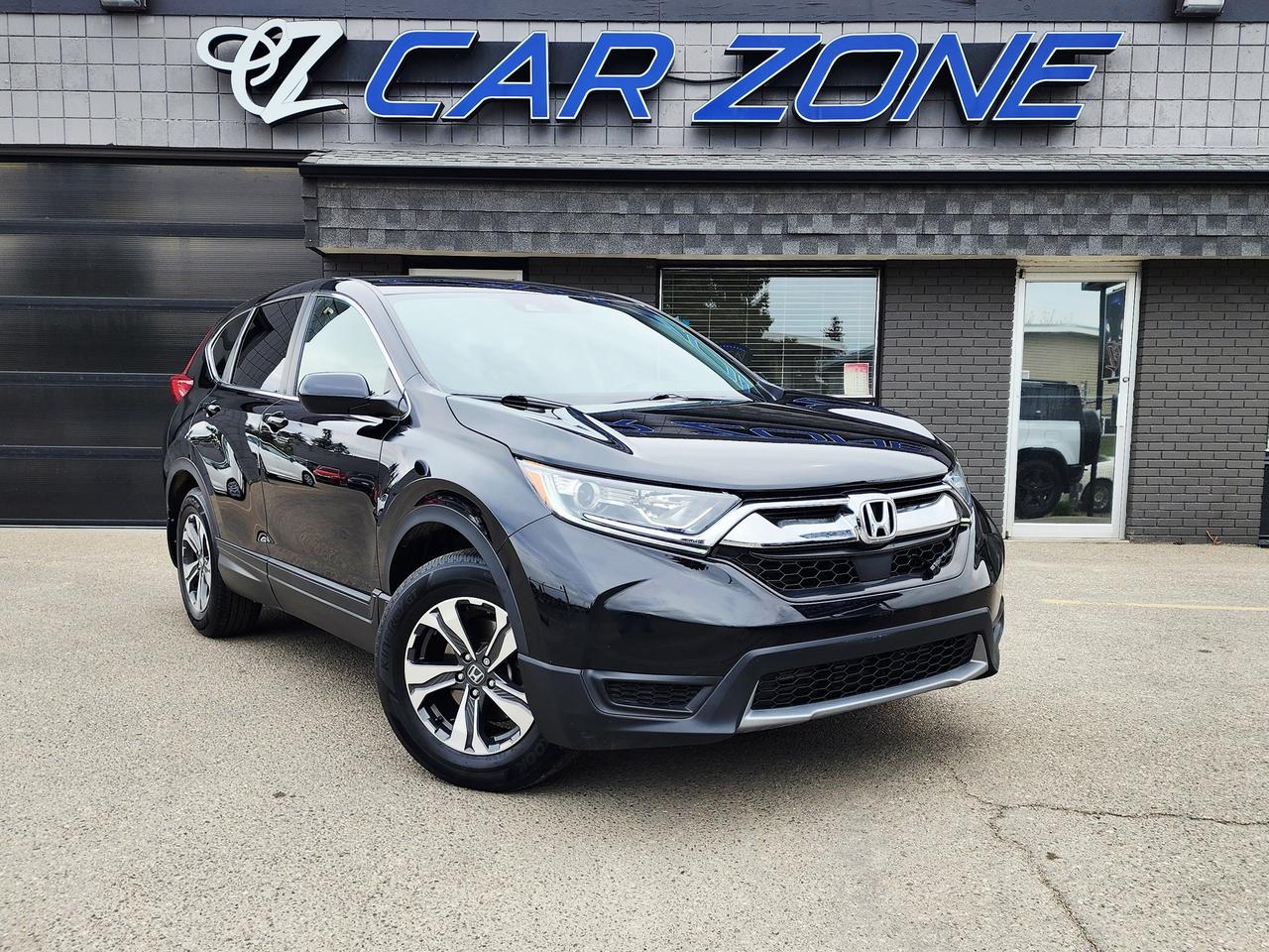 <p>Discover the versatile and capable 2019 Honda CR-V LX, a stylish black-on-black SUV perfect for any Canadian adventure. With a robust 1.5L I4 Turbo engine paired with Hondas renowned Real Time All-Wheel Drive system, this CR-V is engineered to tackle diverse road conditions with confidence, whether youre navigating city streets or exploring B.C.s backroads. Its practical 4-door SUV/Crossover body style offers ample space for passengers and cargo, making it an ideal choice for families, commuters, and weekend warriors alike. This well-maintained CR-V has 71,905 km on the odometer, representing a fantastic opportunity to own a reliable and feature-rich vehicle from Car Zone.</p><p>Here are five features that make this 2019 Honda CR-V LX truly stand out:</p><ul><li><strong>Turbocharged Power:</strong> Experience an exhilarating and efficient drive thanks to the responsive 1.5L turbocharged engine, delivering impressive performance without compromising on fuel economy.</li><li><strong>Real Time All-Wheel Drive:</strong> Conquer any weather with confidence. Hondas intelligent AWD system seamlessly distributes power to all four wheels, providing superior traction and stability on snow, ice, and wet roads.</li><li><strong>Sleek Black Exterior & Interior:</strong> Turn heads with a sophisticated all-black exterior, complemented by a comfortable and stylish black interior that exudes understated elegance.</li><li><strong>Versatile SUV/Crossover Design:</strong> Enjoy the perfect blend of car-like comfort and SUV utility, offering a spacious cabin and flexible cargo space for all your gear and adventures.</li><li><strong>Proven Honda Reliability:</strong> Drive with peace of mind knowing youre investing in Hondas legendary reputation for dependability and longevity, a hallmark of every vehicle on our lot at Car Zone.</li></ul><p>Looking for Your Dream Car? Call Car Zone Today!</p><p>Thanks for viewing our Car Zone inventory. All of our vehicles come fully detailed with a Carfax and a mechanical fitness assessment. Drive this home today! Easy financing options. All credit welcome.&nbsp;<strong><a href=http://www.calgary.ca/finance>APPLY NOW</a>&nbsp;</strong>We even take trades. Same day approvals at&nbsp;<a href=http://www.carzonecalgary.ca/><strong>CARZONECALGARY</strong></a> or visit us in person at 2036 36 Street SE Calgary for a hassle free test drive. Let our friendly team of experts book an appointment with you and show you the Car Zone difference! AMVIC licensed dealer.&nbsp;</p>