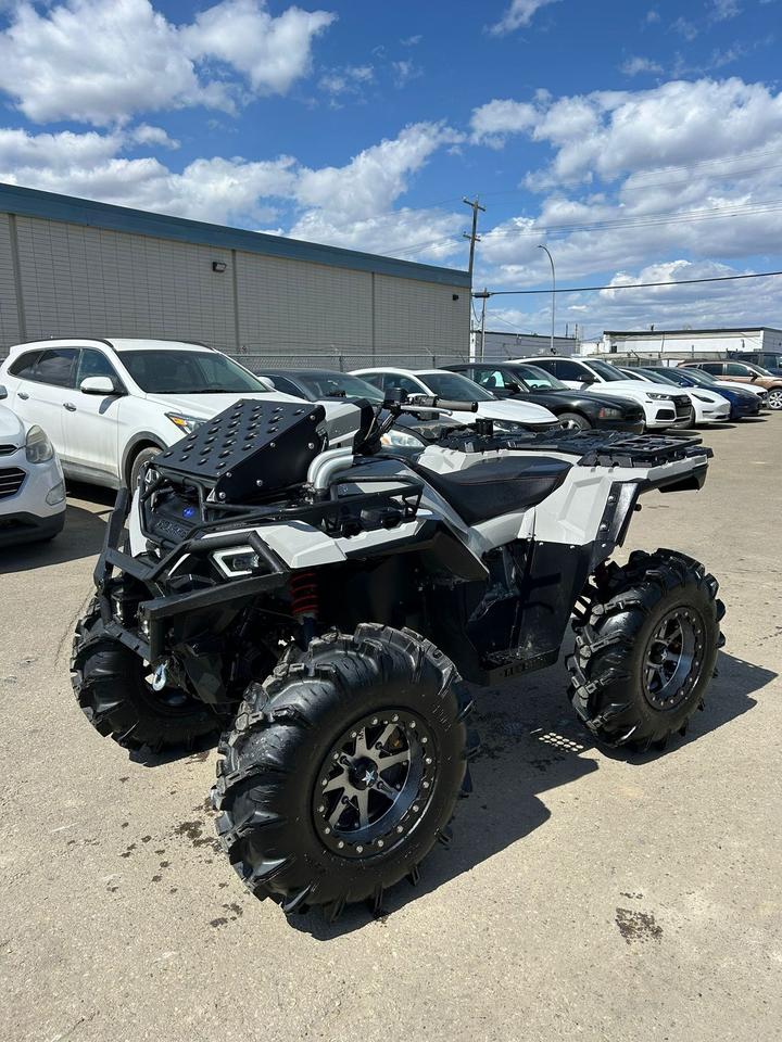 <div><div><div><div><p data-start=0 data-end=384>The 2023 Polaris Sportsman 850 Ultimate Trail is built for riders who want premium comfort, strong utility capability, and confident trail performance in a fully equipped ATV. Powered by a 78 hp ProStar&reg; 850 cc twin-cylinder engine, it delivers strong low-end torque, responsive throttle, and dependable power for hauling, towing, and tackling challenging terrain with ease.</p><p data-start=0 data-end=384>&nbsp;</p><p data-start=386 data-end=739>Purpose-built for rugged versatility, it features On-Demand AWD/2WD for instant traction in changing conditions, along with engine braking and Active Descent Control for improved confidence on steep or technical terrain. Its multi-select Electronic Power Steering (EPS) helps reduce rider fatigue while keeping handling smooth and precise.</p><p data-start=386 data-end=739>&nbsp;</p><p data-start=741 data-end=988>The Ultimate Trail package comes loaded with premium factory upgrades including a 3,500 lb winch, upgraded front and rear bumpers, LED lighting, and a premium seat, making it ready for demanding work or long trail rides right out of the box.</p><p data-start=741 data-end=988>&nbsp;</p><p data-start=990 data-end=1246>Equipped with 27-inch all-terrain tires on aluminum wheels, high-clearance arched A-arm suspension, and impressive ground clearance, this ATV is built to handle mud, rocks, snow, and rough trails while still delivering a comfortable, controlled ride.</p><p data-start=990 data-end=1246>&nbsp;</p><p data-start=1248 data-end=1456>With strong towing capability, durable front and rear racks, and rugged Polaris construction, the 2023 Polaris Sportsman 850 Ultimate Trail is equally at home on the job site or deep in the backcountry.</p><p data-start=1248 data-end=1456>&nbsp;</p><p data-start=1458 data-end=1543 data-is-last-node= data-is-only-node=>Contact us today to learn more about financing, trade-ins, or delivery across Canada!</p></div></div></div></div>