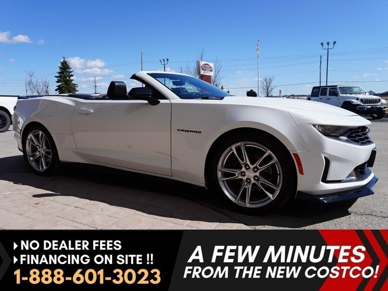 6th Gen 2020 Chevrolet Camaro Convertible  Rally Sport (RS) loaded -- 3LT Premium Package  -- after full market ground effects package -- 3.6L V6 engine -- 10- Speed Automatic -- New redesigned front grille  Bose Premium Audio system -- Heads Up Display -- Power-operated roof  --  Rear Decklid spoiler -- 20-inch 5-split-spoke wheels -- Interior Spectrum Lighting with 24 selectable colors  Chevrolet Infotainment 3 system with Apple Car and Android Auto and Rear Backup camera. 

Sharp Summit white exterior, black convertible top, black front and rear bow tie emblems -- Customizable interior lights, leather bucket seats -- 6-way power front seats -- Heated seats and heated steering wheel. 


Features
- 10-speed automatic
- 3.6L V6 engine
- 335 horsepower and 284 lb-ft of torque
- Chevrolet Infotainment 3 system 
- Dual climate control
- Heads Up Display
- Heated seats
- Heated steering wheel
- Driver Mode Control system
- Backup camera 
- 10-speed automatic
- 20-inch 5-split-spoke wheels
- RS-specific grille
- Dark-tinted taillights
- Power-operated roof
- LED Daytime Running Lights
- LED headlights with signature light bar
- Apple CarPlay / Android Auto Compatible
- Bluetooth
- Sirius XM Compatible
- Wifi hotspot
- Bose Premium Audio System
- Rear decklid spoiler
- Black front and rear Bow Tie emblems
- Leather-wrapped steering wheel
- 6-way power seats
- Chevrolet Infotainment 3 system 
- Interior Spectrum Lighting with 24 selectable colors
- Rear window defroster
- Steering wheel integrated controls