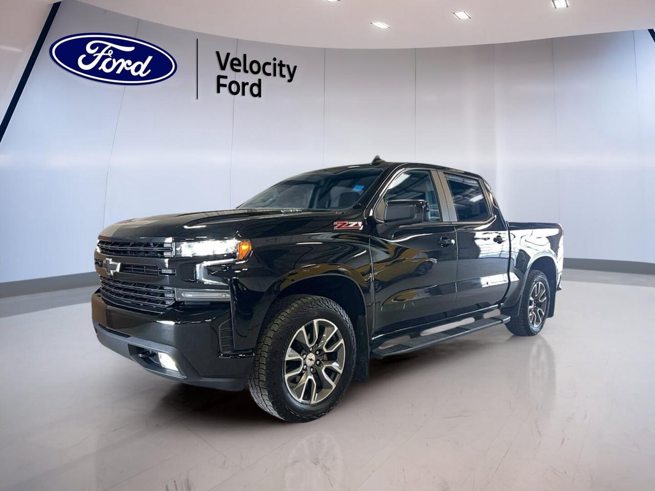 Built to handle hard work and long highway runs, this used 2021 Chevrolet Silverado 1500 Crew Cab Short Box 4-Wheel Drive RST delivers strong diesel torque, a smooth 8-speed automatic transmission, and confident 4WD traction. Finished in Black with a Black interior, it brings a clean, bold look to this capable full-size pickup.

With 121,338 km, this Silverado 1500 Crew Cab Short Box 4-Wheel Drive RST remains a smart choice for drivers in Moose Jaw who want towing muscle and everyday comfort. Its crew cab layout, four full doors, and short box design make it easy to balance jobsite utility with family-friendly space.

FEATURES OF THE Silverado 1500 Crew Cab Short Box 4-Wheel Drive RST
»» Bold RST appearance with black styling
»» Crew Cab adds roomy rear seating
»» Short box supports daily cargo needs
»» Four-wheel drive adds all-season confidence

TRUCK FEATURES
»» Towing capacity rated at 5,397 kg
»» Short box supports versatile cargo hauling
»» Rear tow hook aids recovery needs
»» Limited slip differential boosts traction

ADVANCED SAFETY FEATURES
»» Backup camera helps with reversing visibility
»» Anti-lock braking system supports controlled stops
»» Stability control adds confident road manners
»» Side and head airbags enhance protection

PERFORMANCE AND EFFICIENCY
»» 3.0-litre diesel delivers strong torque output
»» 8-speed automatic shifts smoothly under load
»» Four-wheel drive improves traction on loose surfaces
»» Cruise control supports relaxed highway travel

COMFORT AND CONVENIENCE
»» Heated front seats add cold-weather comfort
»» Dual-zone climate control helps cabin comfort
»» Remote starter warms truck before entry
»» Driver power seat includes lumbar support

TECHNOLOGY AND CONNECTIVITY
»» Bluetooth integration supports hands-free phone use
»» WiFi hotspot helps keep devices connected
»» Satellite radio expands entertainment choices
»» Steering wheel audio controls ease use

CARGO SPACE
»» Short box handles tools and weekend gear
»» Crew cab adds secure interior storage
»» Rear trunk access improves loading convenience
»» Four-door layout simplifies passenger and cargo access

AWARDS & RECOGNITIONS
»» Best Buy Award, The Car Guide, 2021
»» Best Full-Size Pickup, AutoTrader Canada Awards, 2021

WHAT OTHER OWNERS LIKE
»» Strong diesel torque for towing confidence
»» Spacious crew cab for family comfort
»» Smooth ride for a full-size truck
»» User-friendly controls and easy connectivity

This Chevrolet pickup is well equipped with practical features that make daily driving easier. You get power steering, power windows, heated mirrors, electric mirrors, tinted windows, automatic door locks, front air conditioning, rear air conditioning, rear climate control, rear window defroster, and push button start for added ease.

The cabin is set up for comfort and control. It includes cloth seating, a leather steering wheel, an adjustable steering wheel, automatic climate control, dual-zone climate control, heated front seats, and steering wheel audio controls. These features help create a relaxed drive in changing prairie weather.

This truck also offers the confidence buyers want in a used full-size pickup. Anti-Lock Braking System, stability control, driver airbag, passenger airbag, passenger airbag sensor, side impact airbags, head side airbags, tire pressure monitoring, and a backup camera all help support safer travel on busy roads and rural routes.

For drivers who need a truck that can tow, commute, and handle changing road conditions, this Silverado 1500 Crew Cab Short Box 4-Wheel Drive RST stands out with proven diesel performance and practical equipment. It is a capable, comfortable, and well-rounded Chevrolet truck ready for work and daily life in Moose Jaw.

This 2021 Chevrolet Silverado 1500 Crew Cab Short Box 4-Wheel Drive RSTs VIN is: 3GCUYEET3MG454609 .
