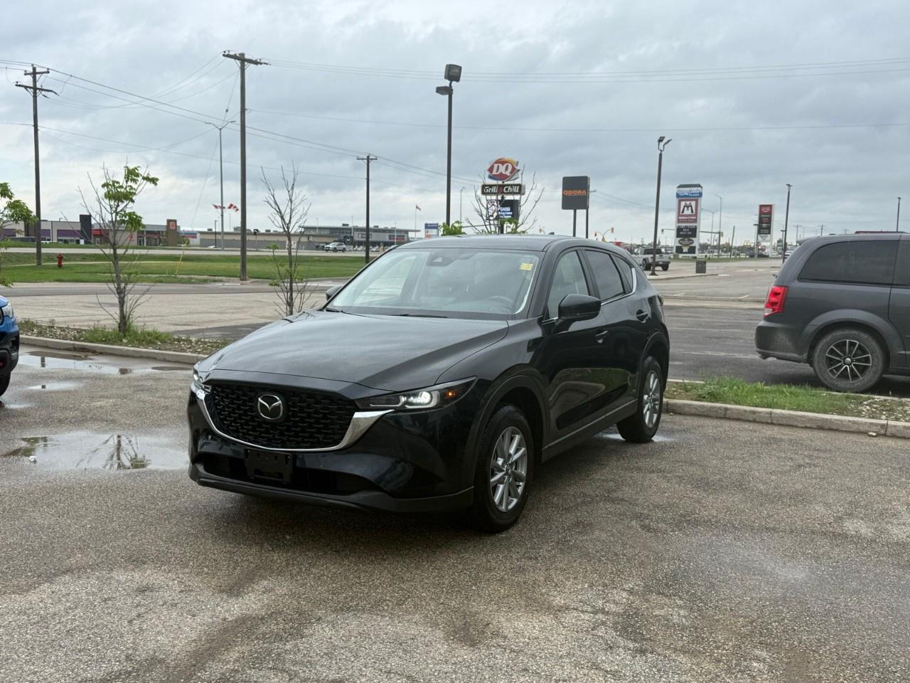 This 2025 Mazda CX-5 GS AWD balances everyday utility with sophisticated style, utilizing a dependable 187-hp 2.5L Skyactiv-G engine paired with a 6-speed automatic transmission and standard i-Activ AWD. The cabin elevates comfort with black leatherette upholstery, a heated leather-wrapped steering wheel, automatic dual-zone climate control, and a convenient power rear liftgate. Come by Highway Mazda today!