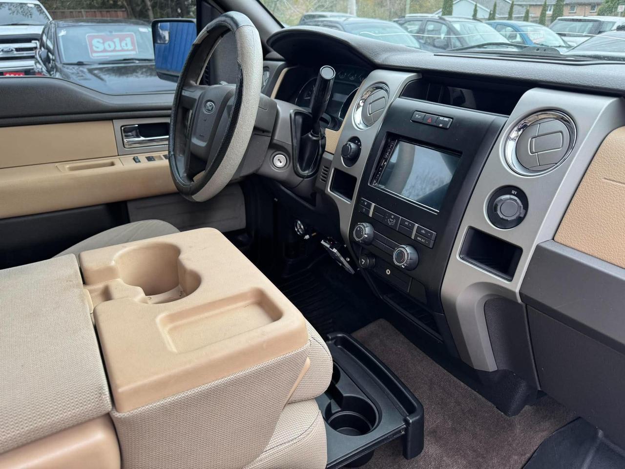 2011 Ford F-150 4WD SUPERCREW 145" XLT Photo